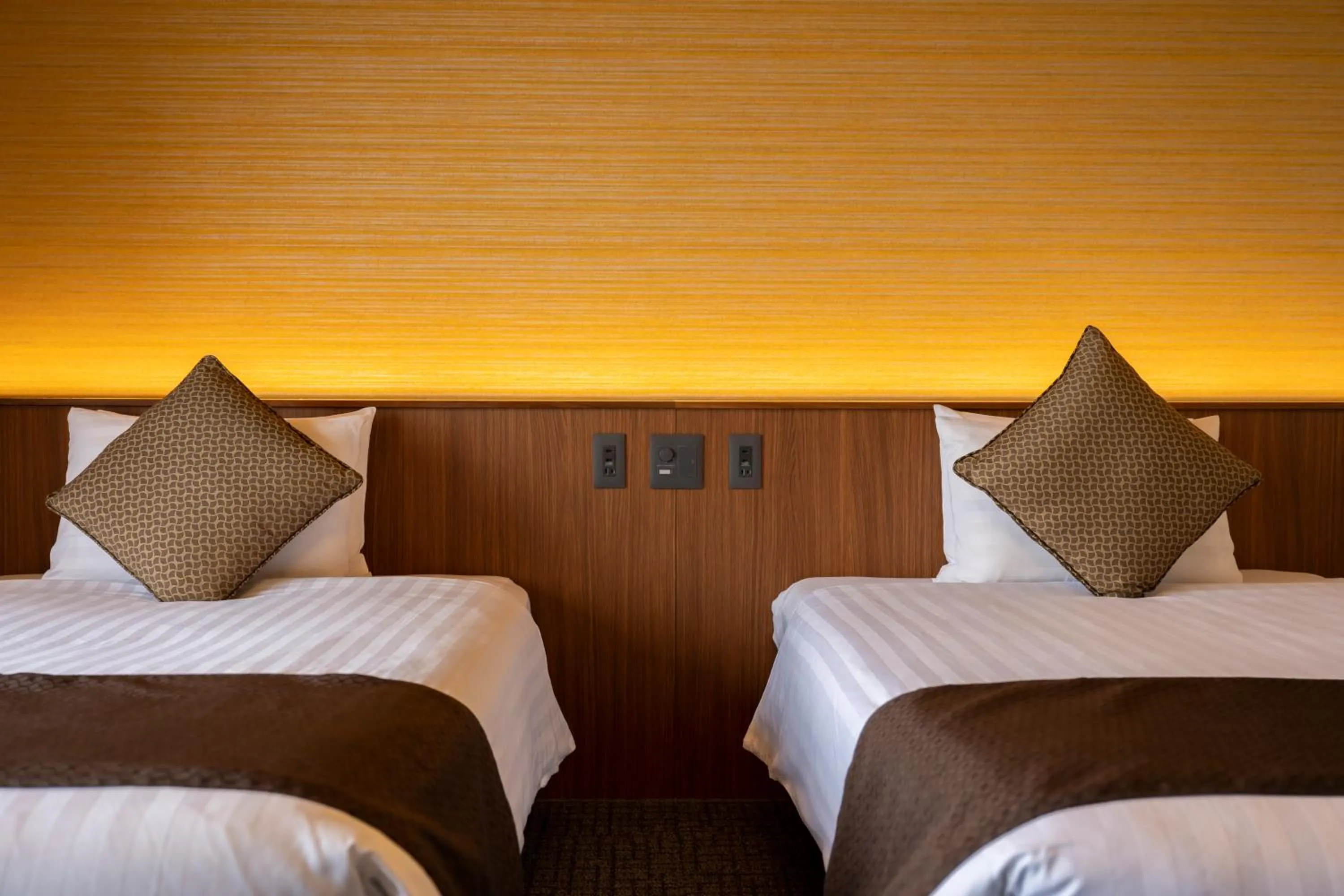 Bed in KAMENOI HOTEL Kujukuri