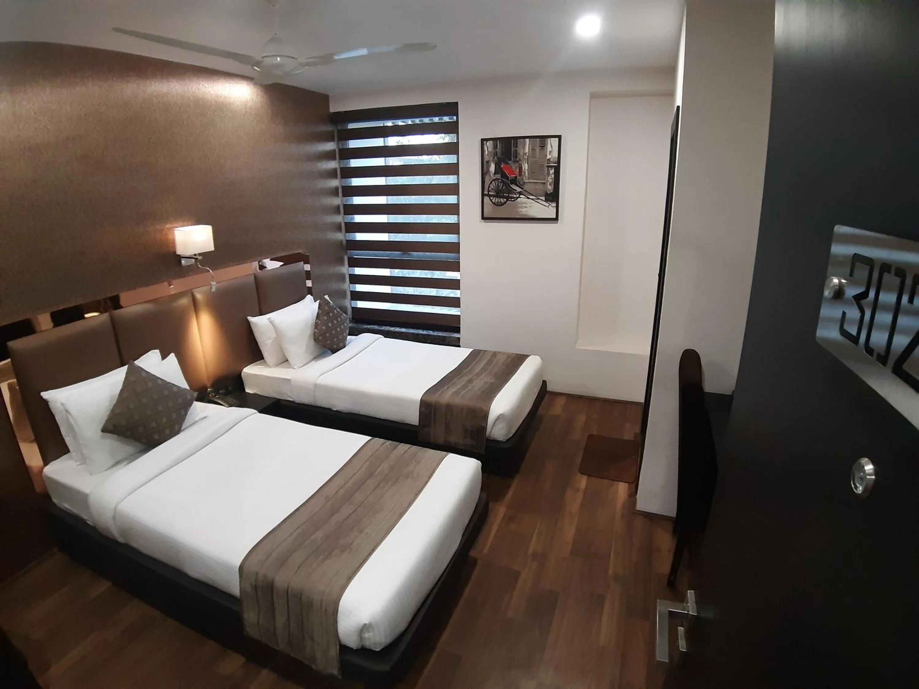 Photo of the whole room, Bed in The Opus Kolkata - A Boutique Hotel