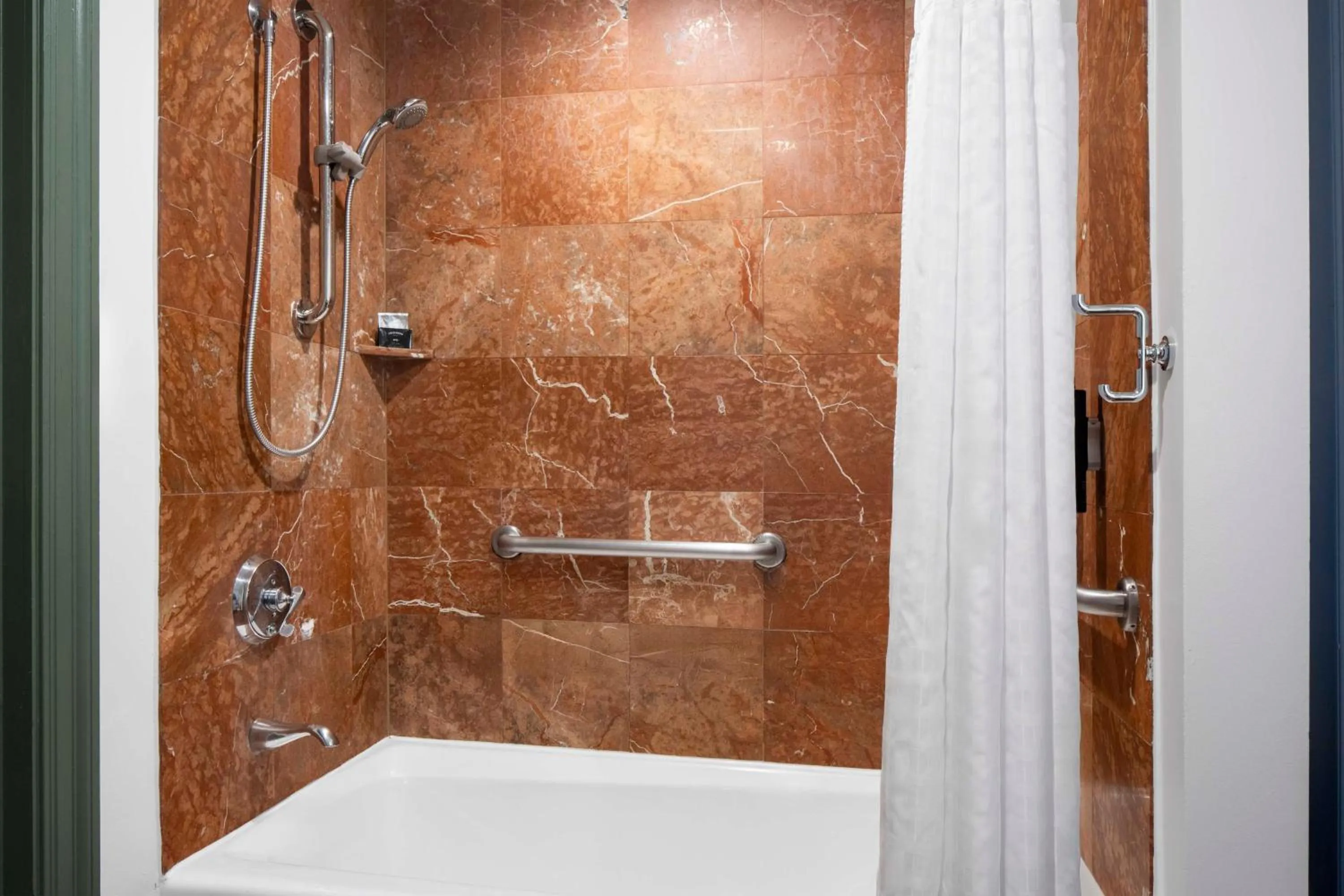 Bathroom in Hotel Theo New Orleans, Tapestry Collection by Hilton