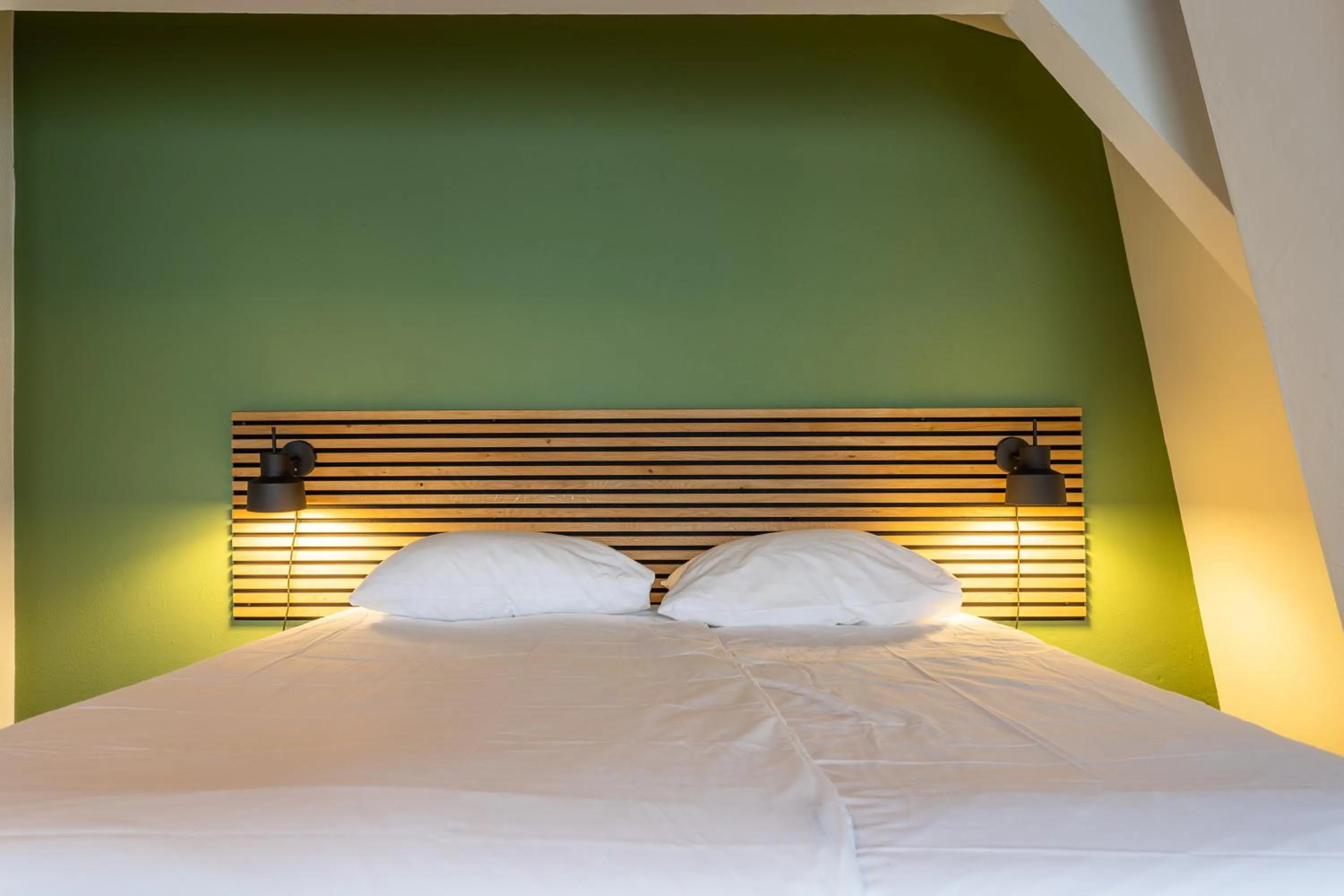 Bed in Weber Hotel 117