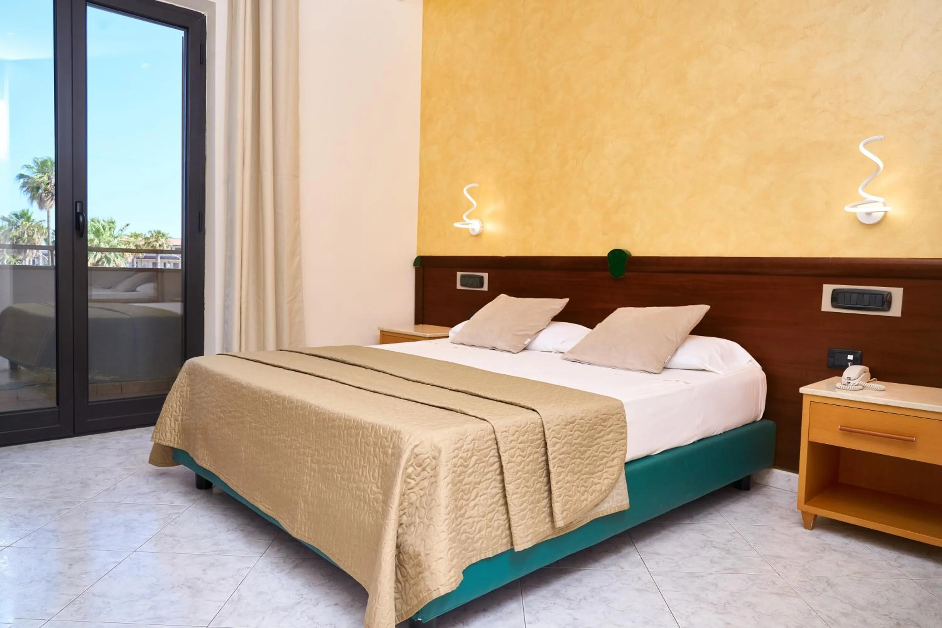 Bed in Hotel Miramare