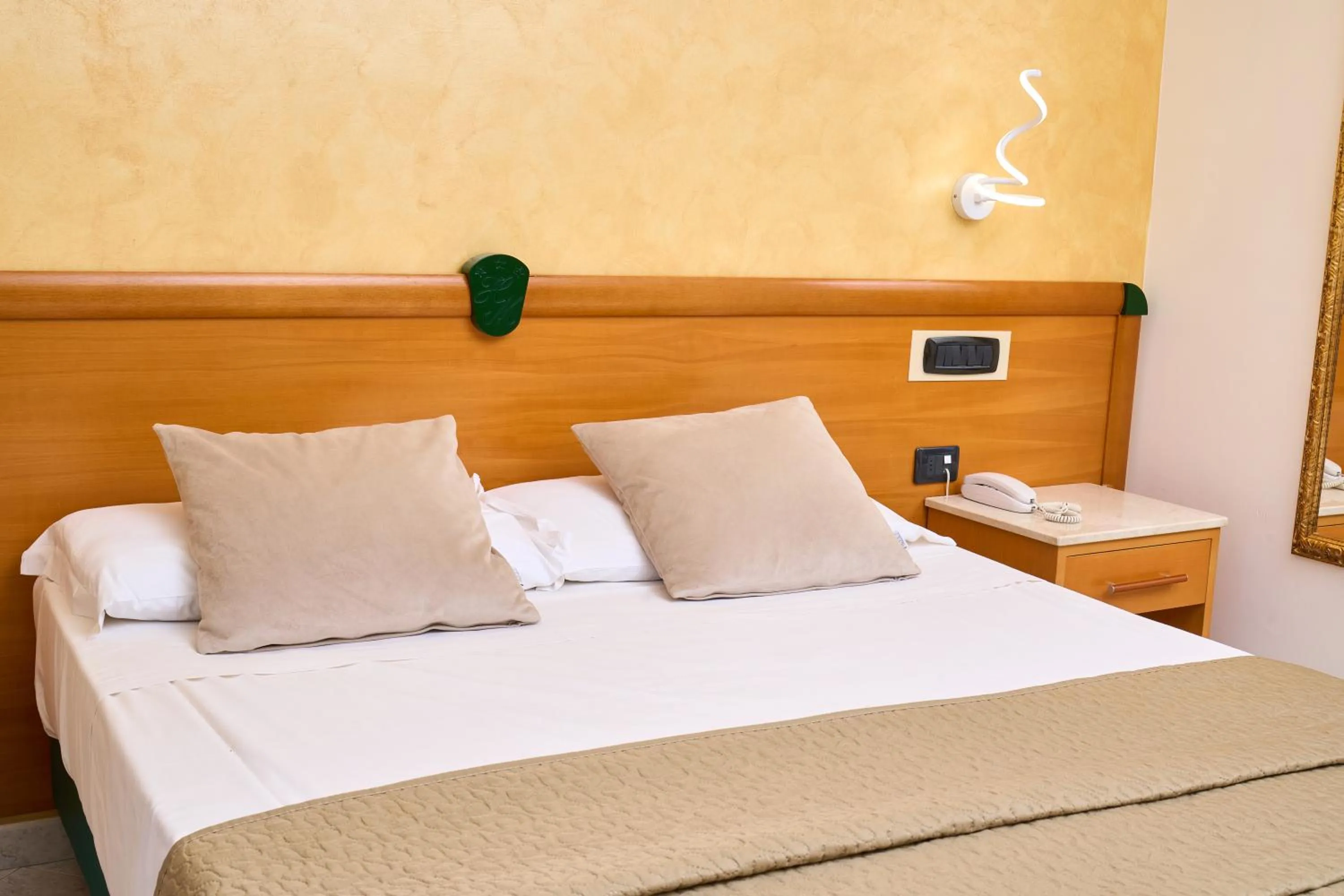 Bed in Hotel Miramare