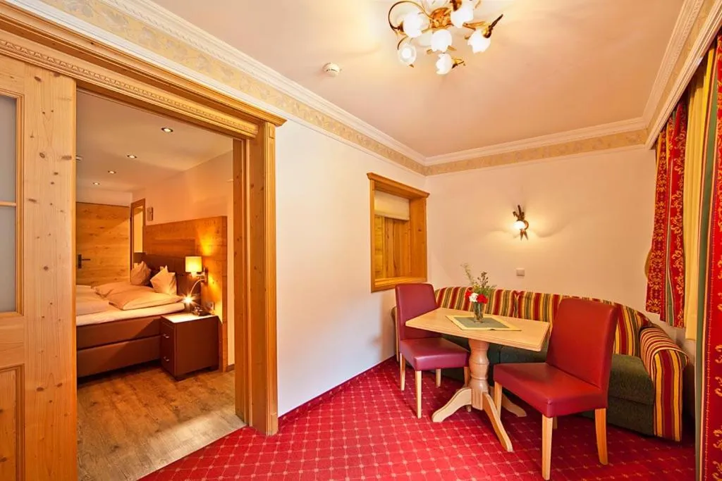 Living room, Bed in Landhotel Denggerhof