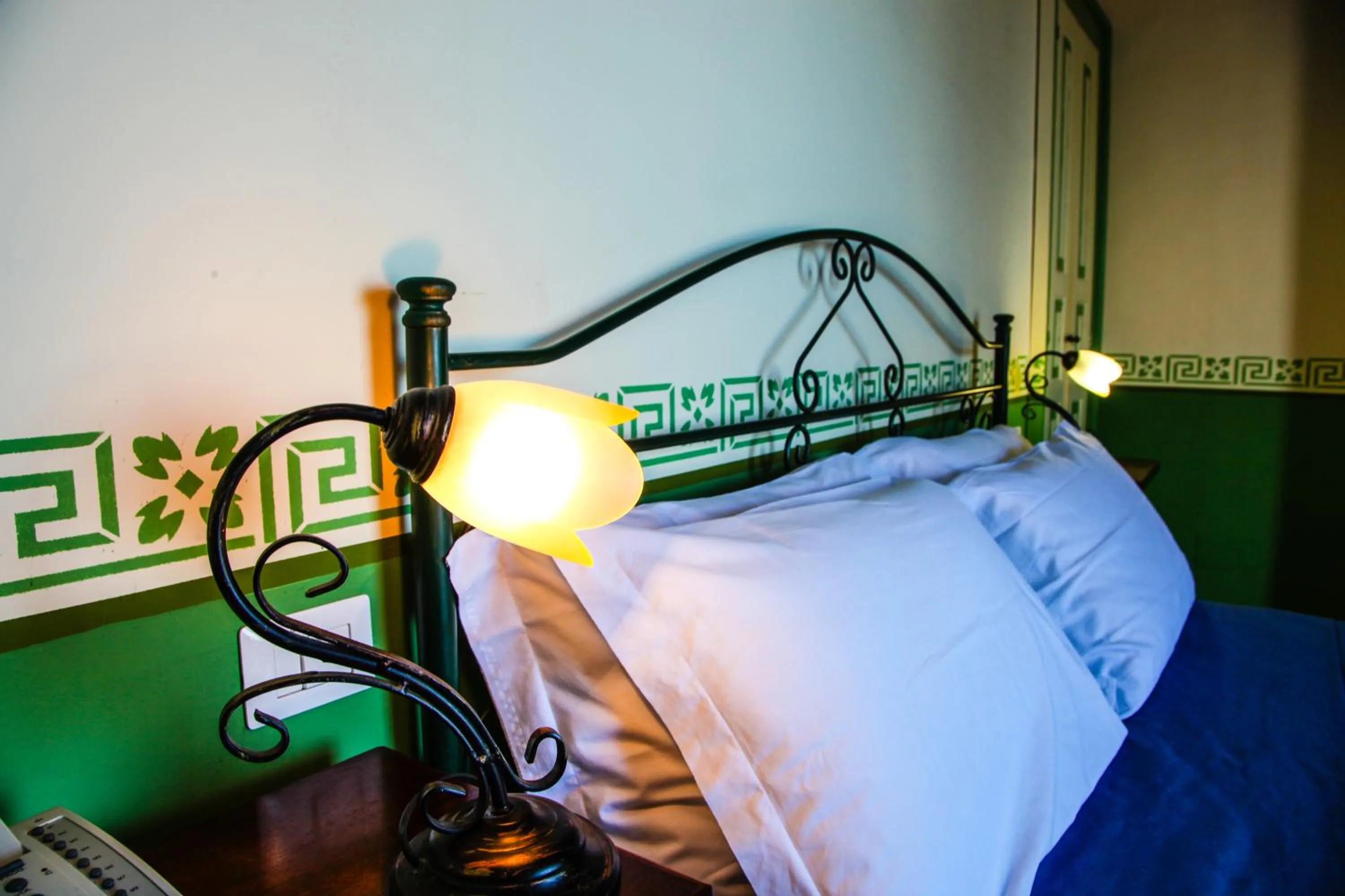 Decorative detail, Bed in Hotel Arcangelo - Salina