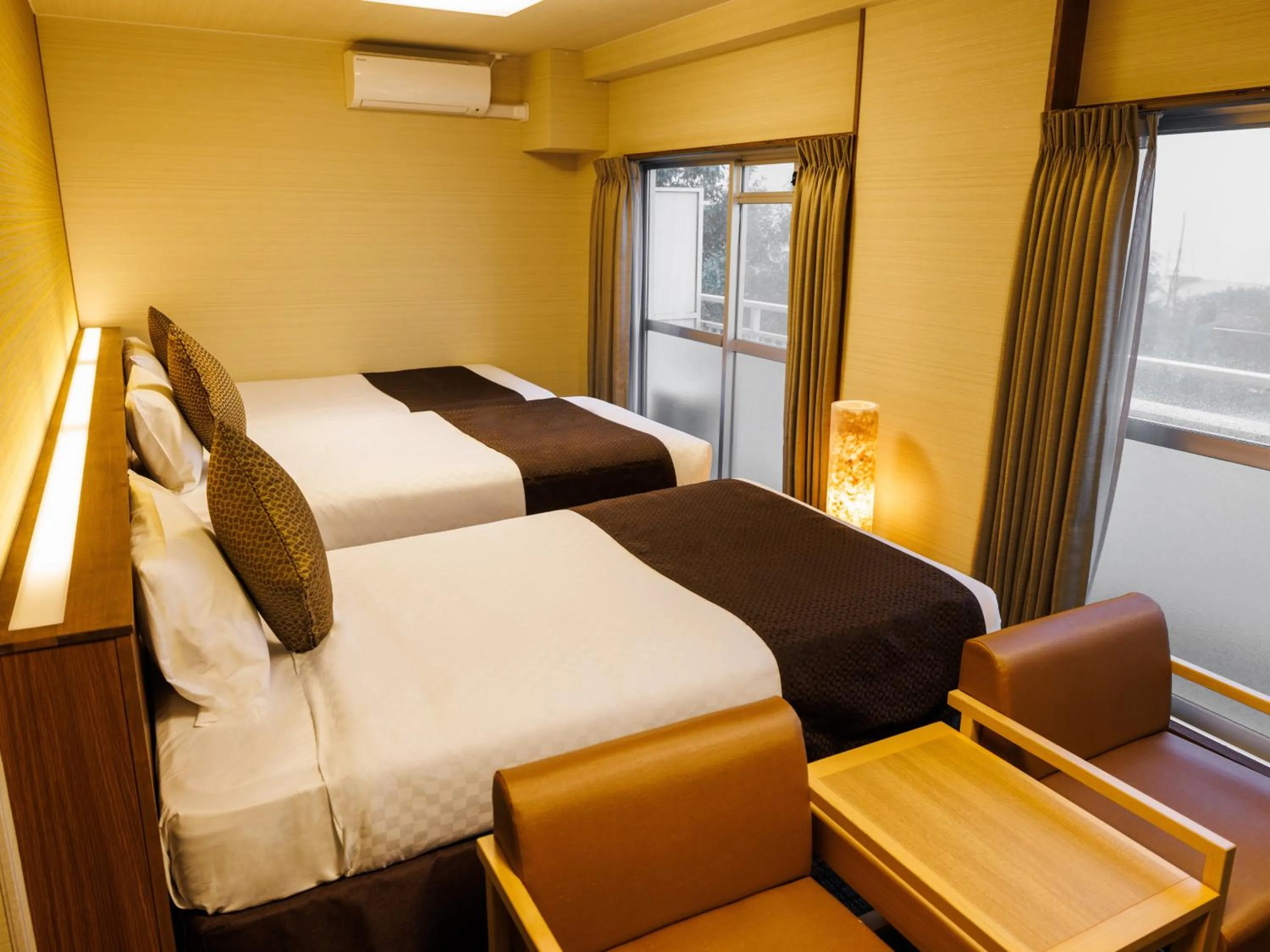 Bed in KAMENOI HOTEL Yamato Heguri