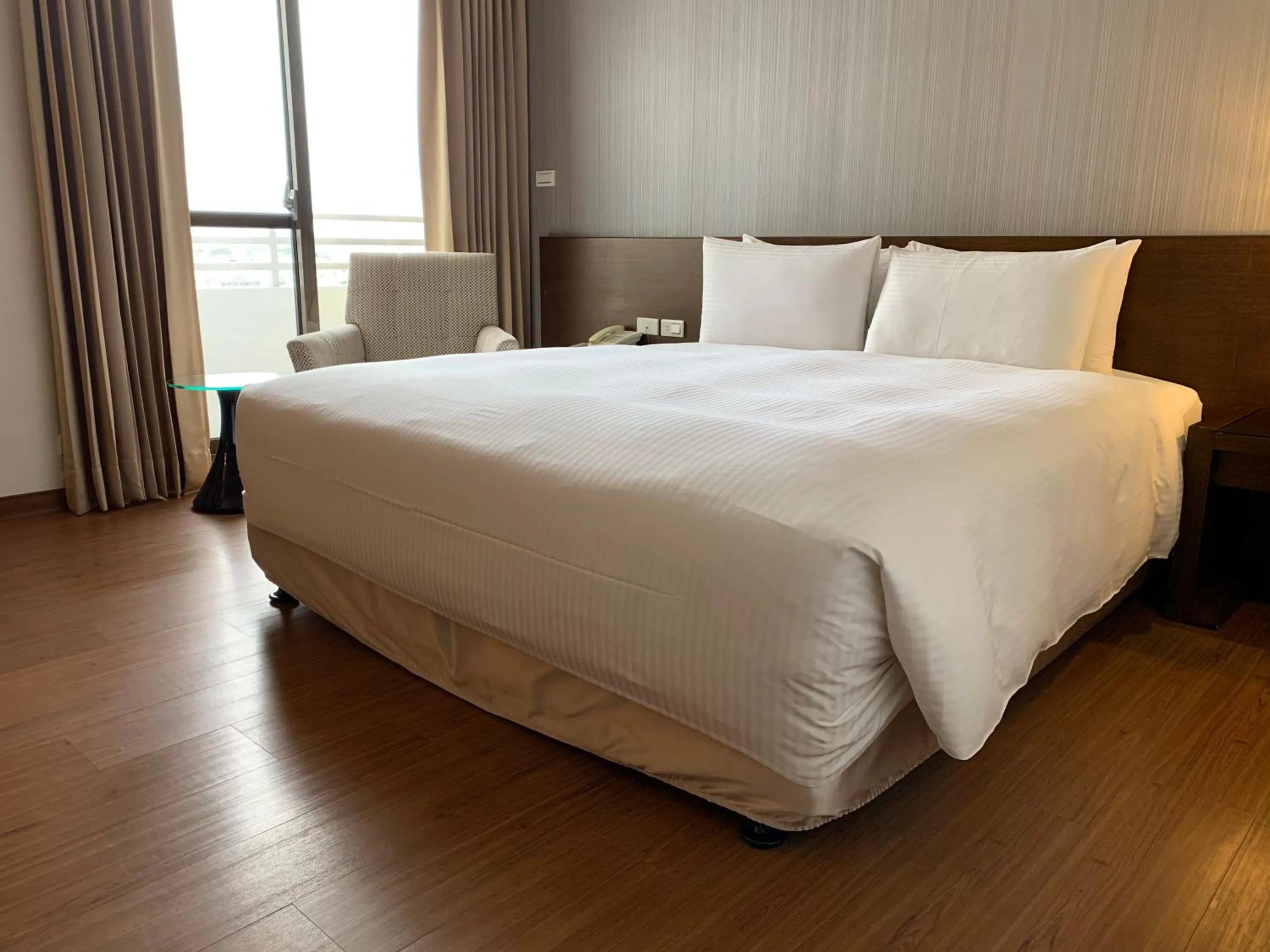 Bed in Ramada Encore By Wyndham Hualien
