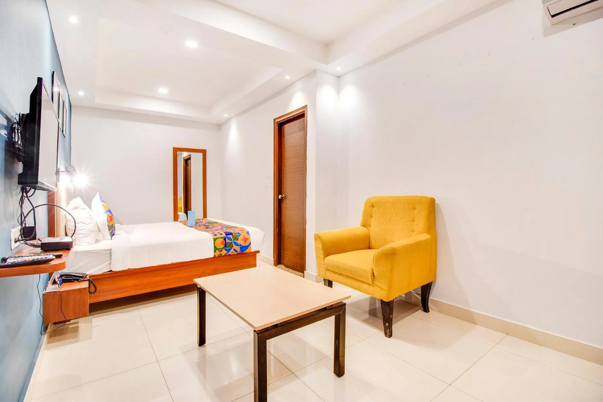 Seating area, Bed in Hotel The Sun Suites - Yelahanka