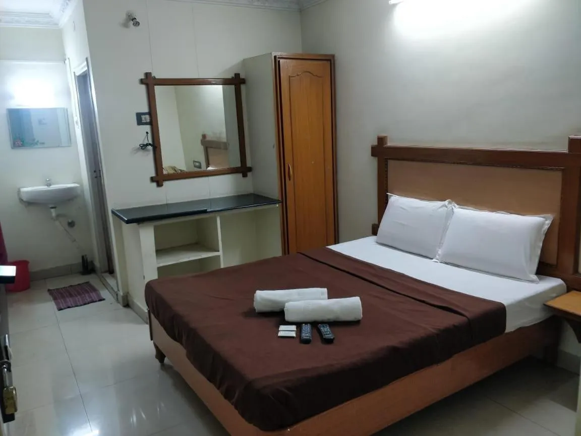 Bed in Hotel Lakshmi Residency