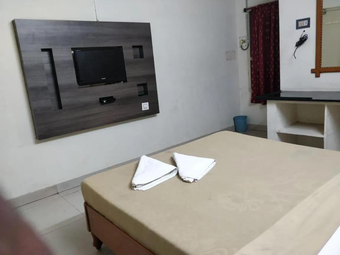 Bed in Hotel Lakshmi Residency