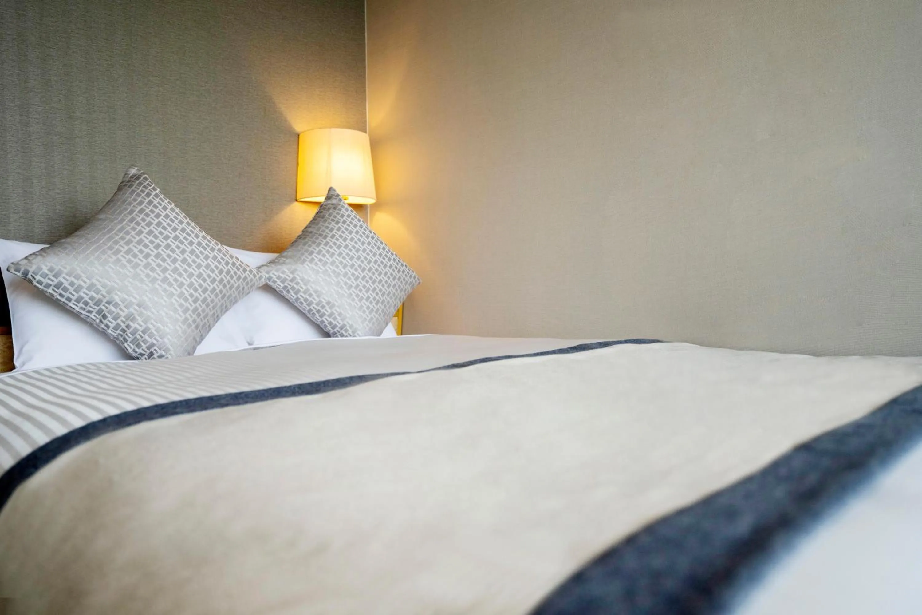 Bed in KAMENOI HOTEL Hikone