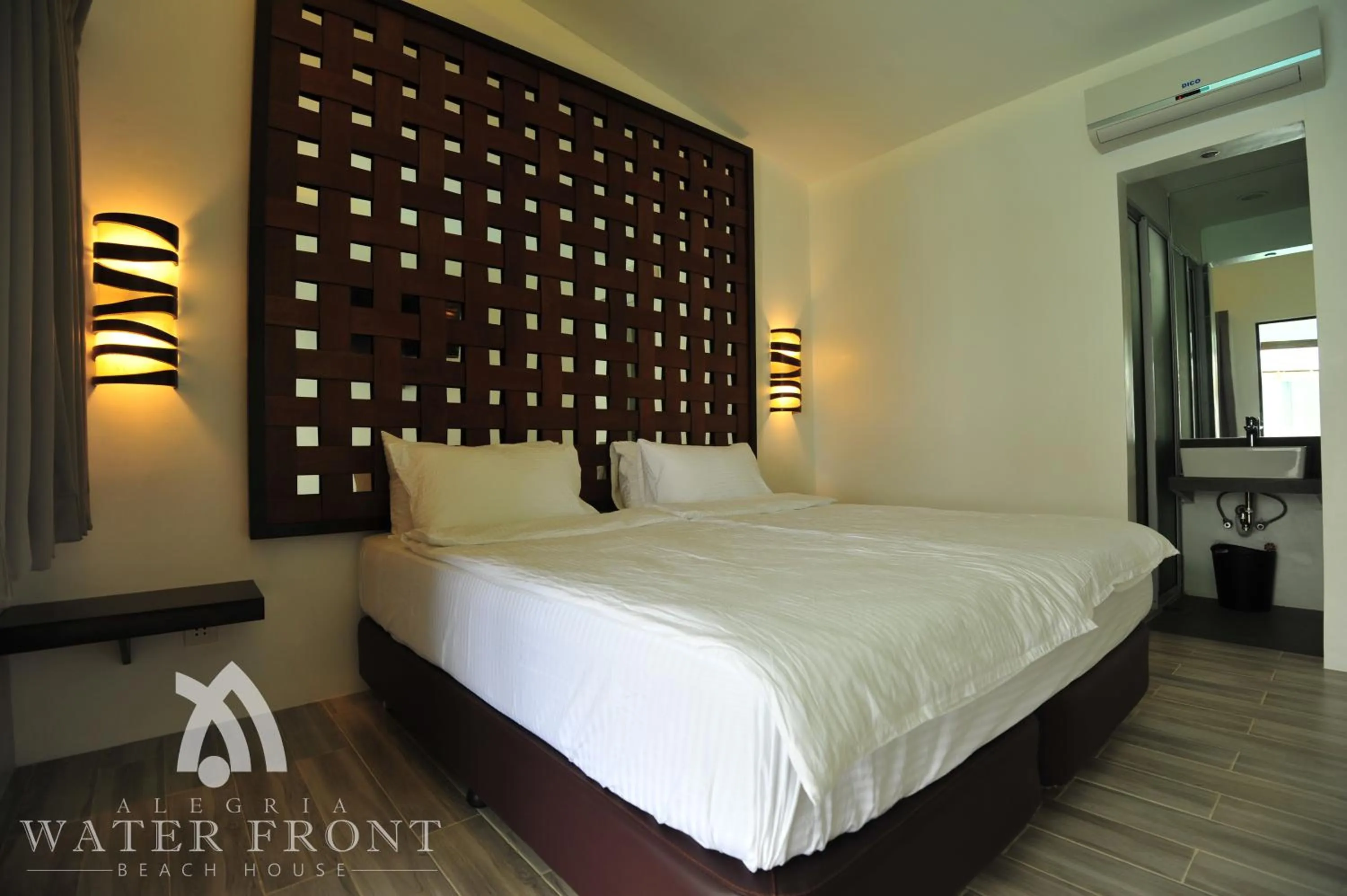 Bed in Alegria Water Front Beach House