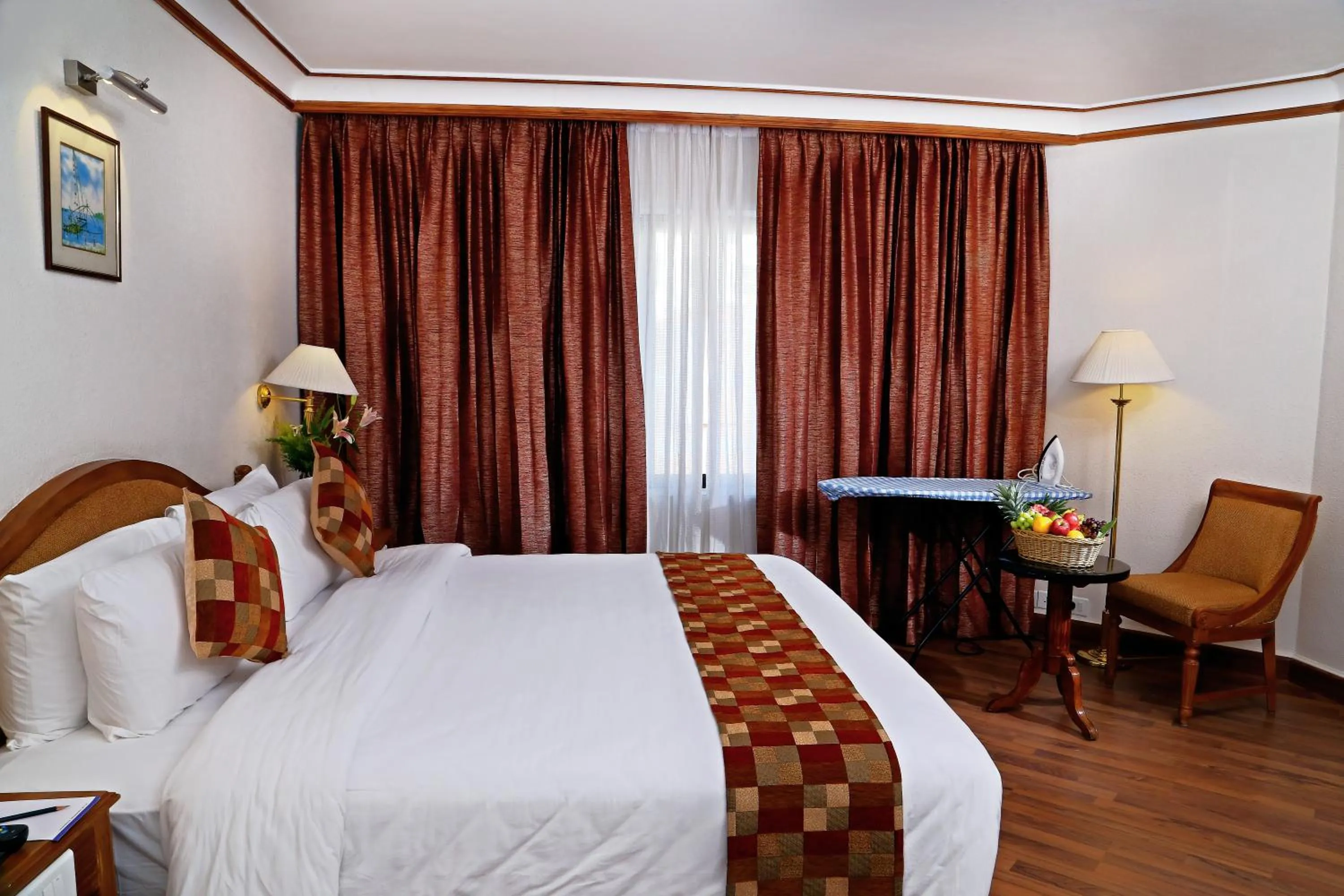 Seating area, Bed in Gokulam Park Hotel & Convention Centre