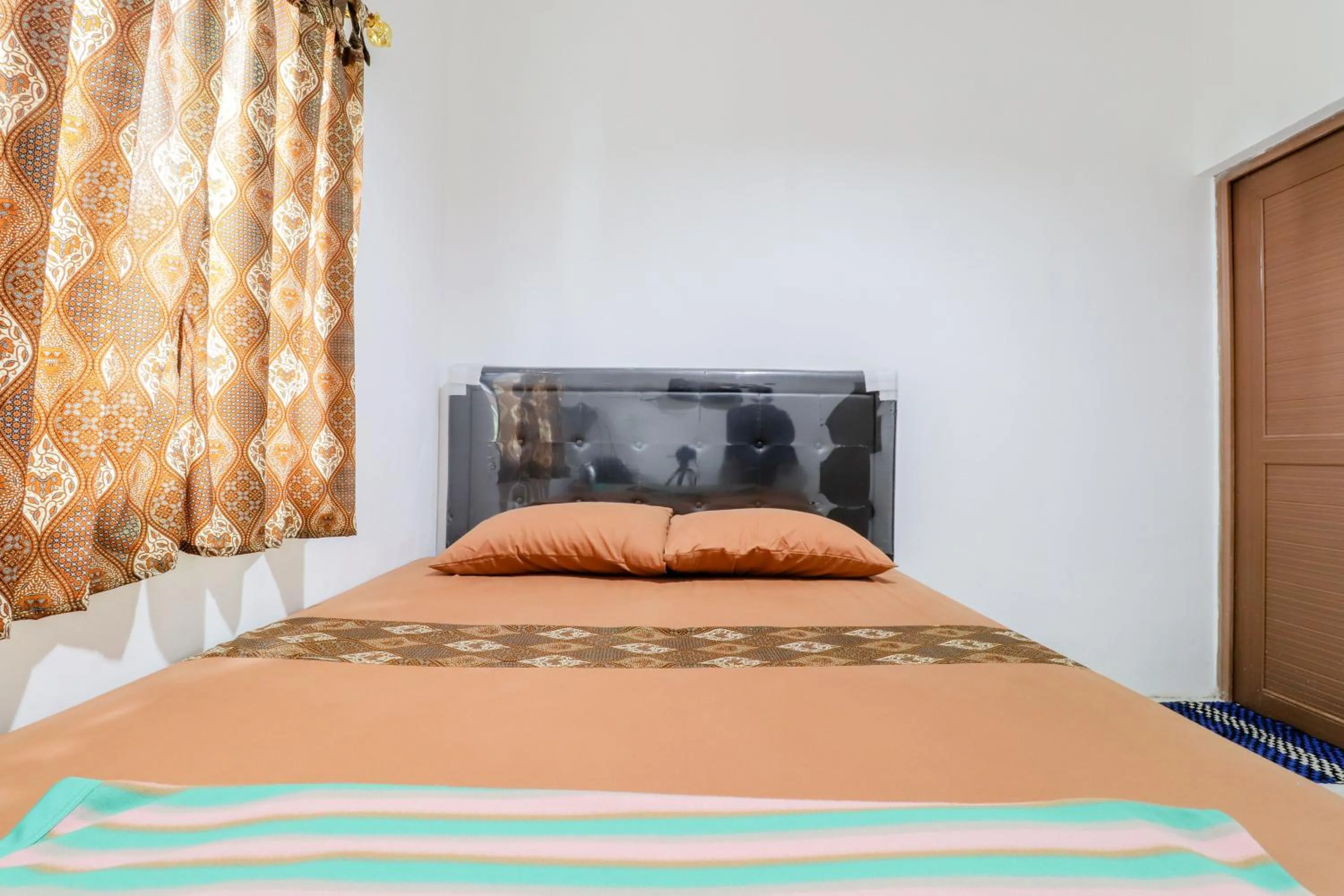 Bed in Java Homestay