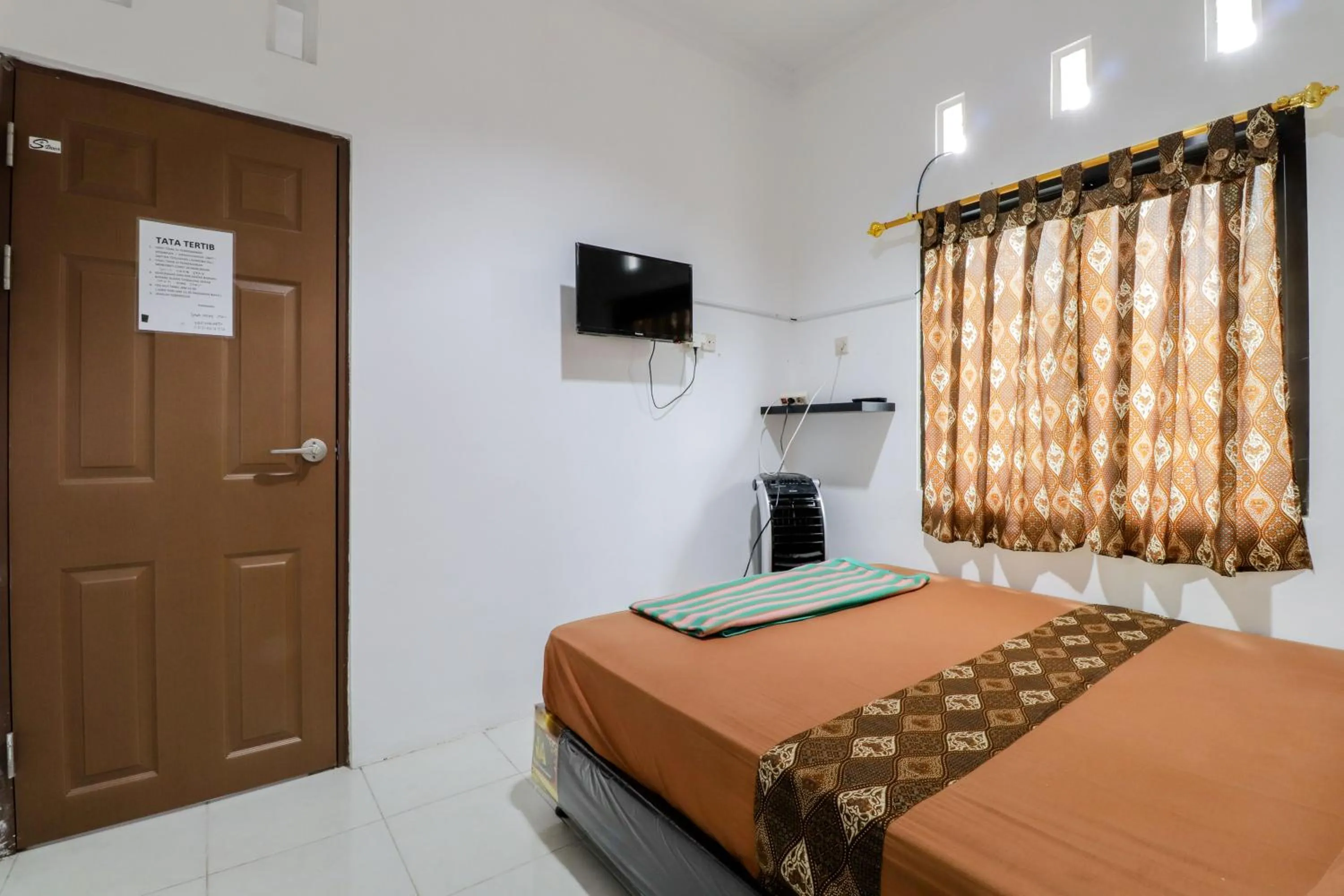 Bed in Java Homestay