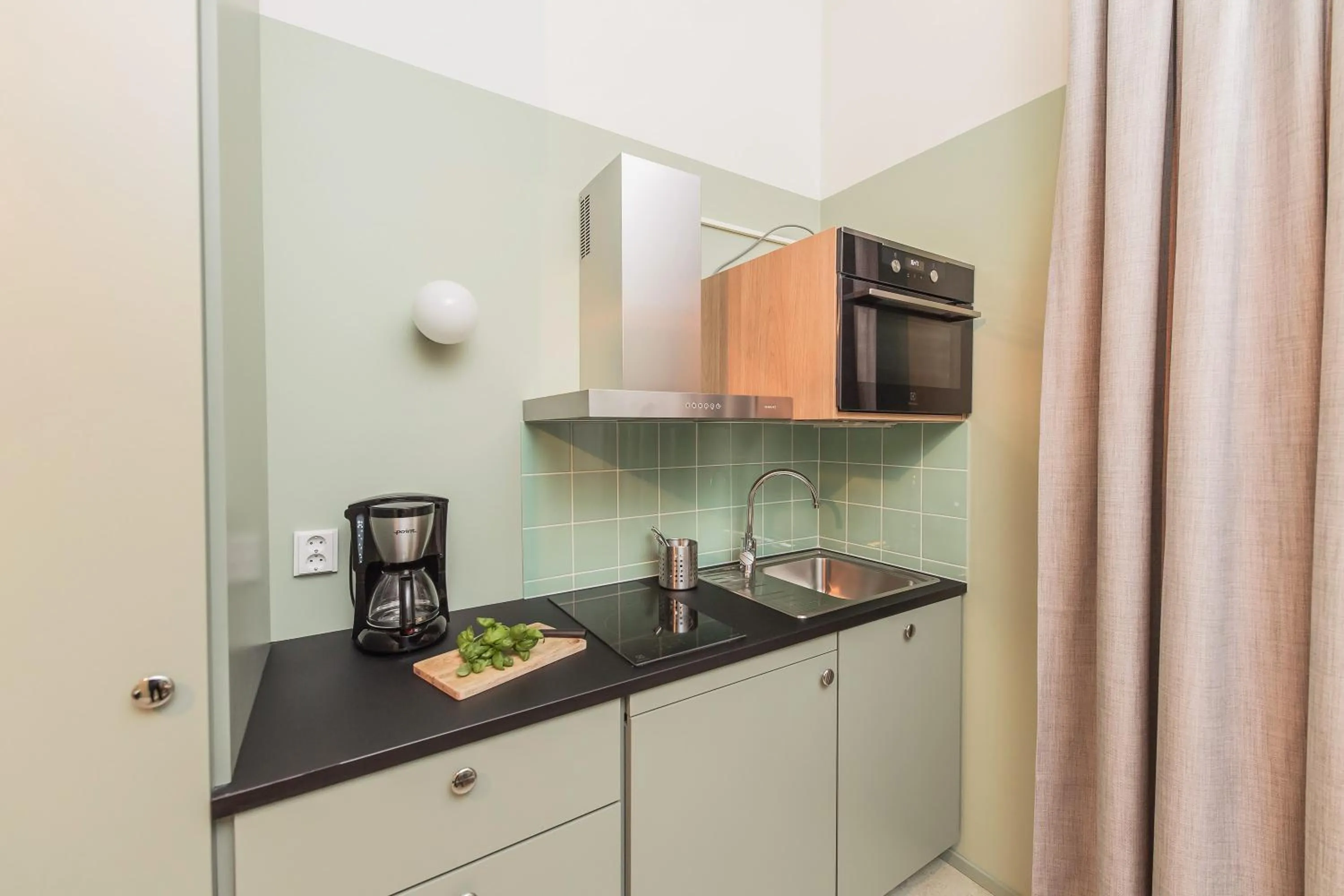 Kitchen or kitchenette in Forenom Aparthotel Jyväskylä