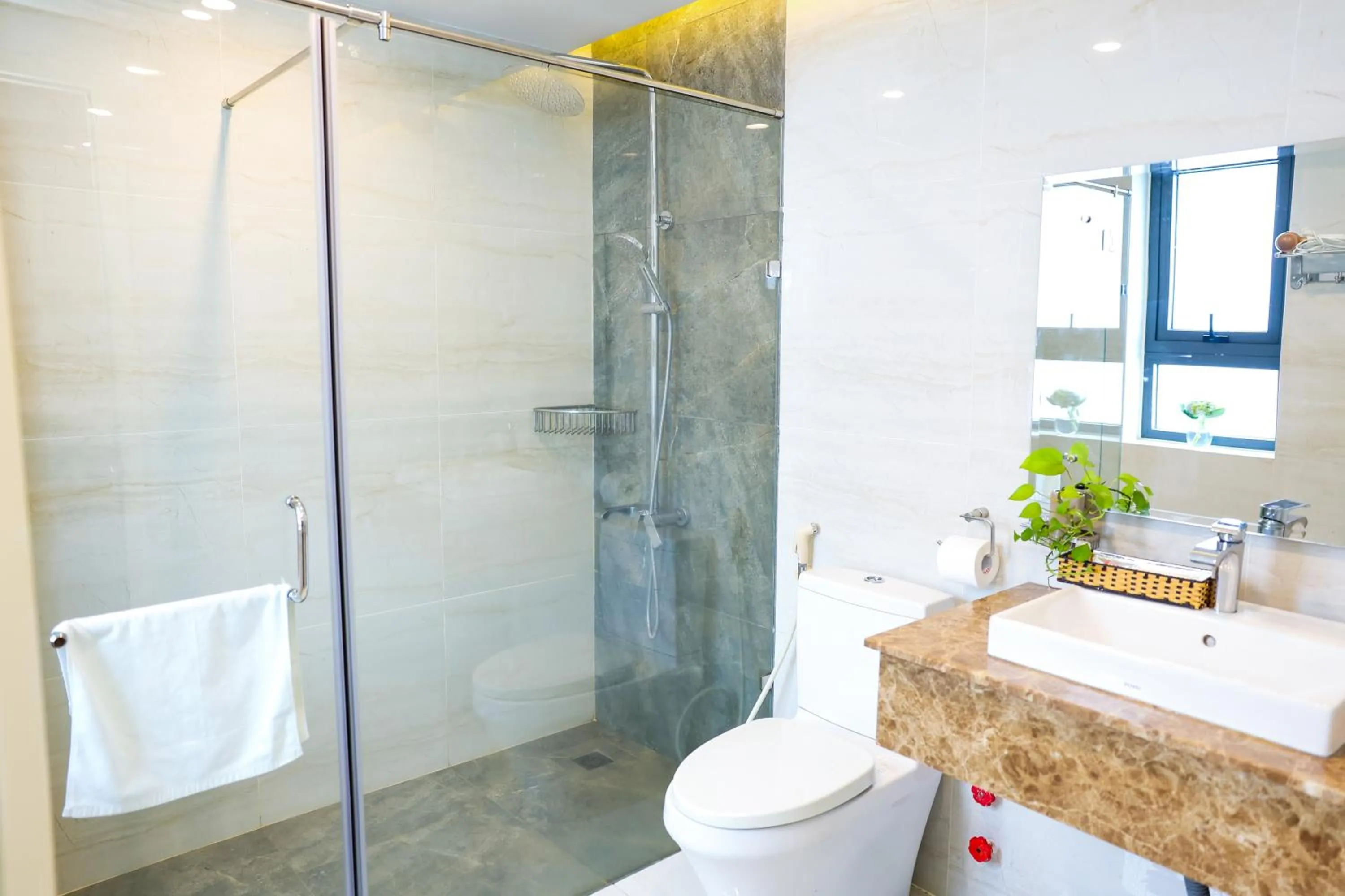 Bathroom in Warm Ways Hotel & Serviced Apartments