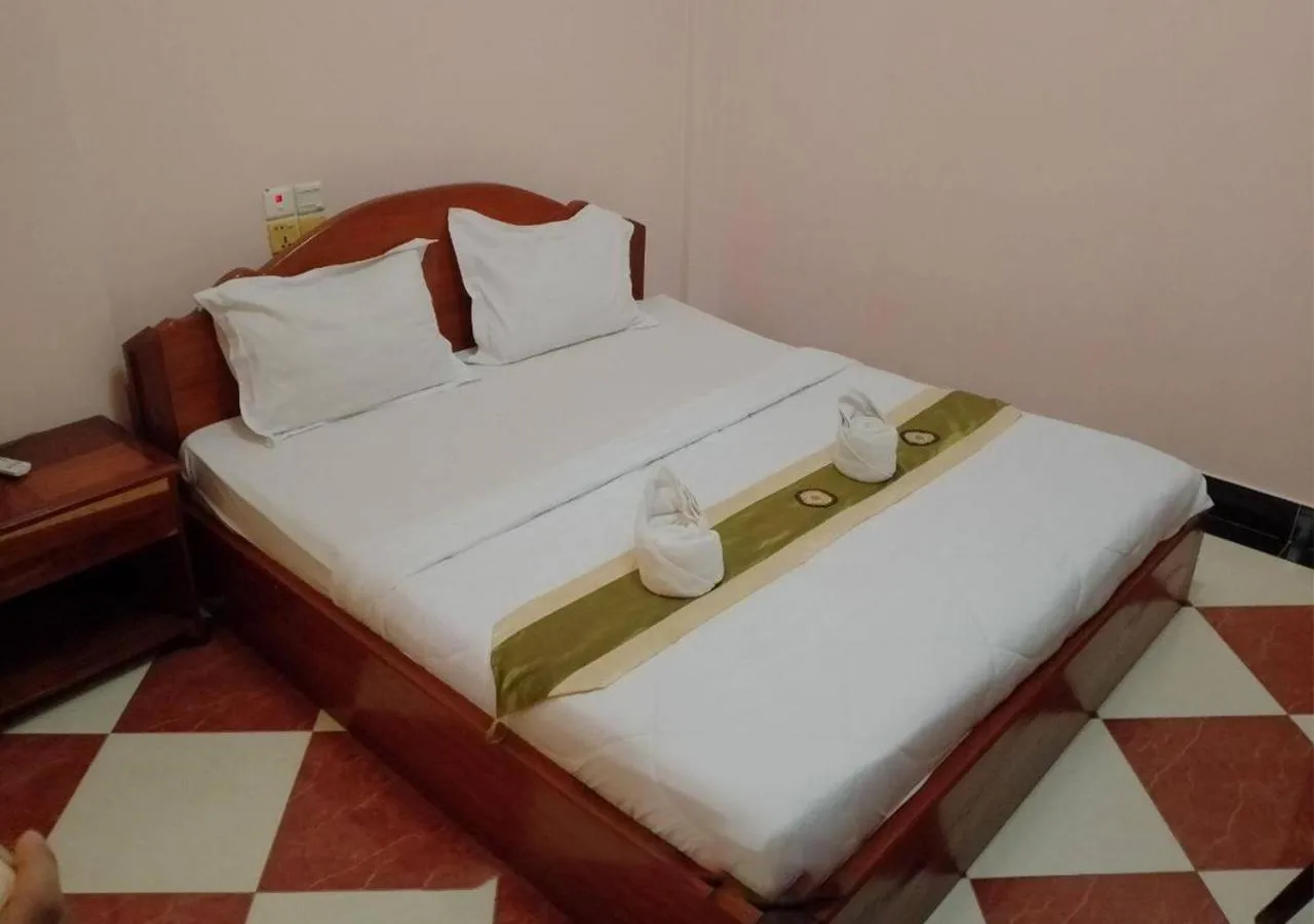 Bed in Nawin Palace Guesthouse