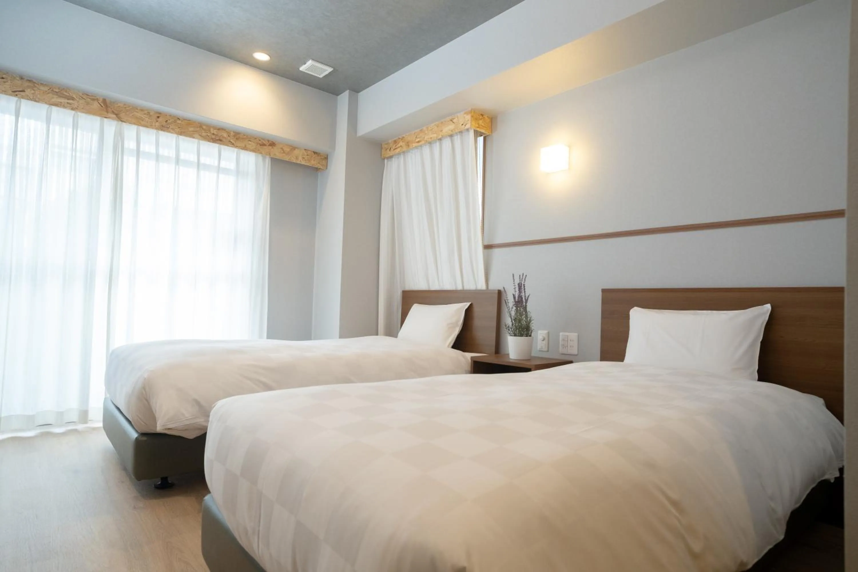 Bed in WAYFARER Kyoto Shijo