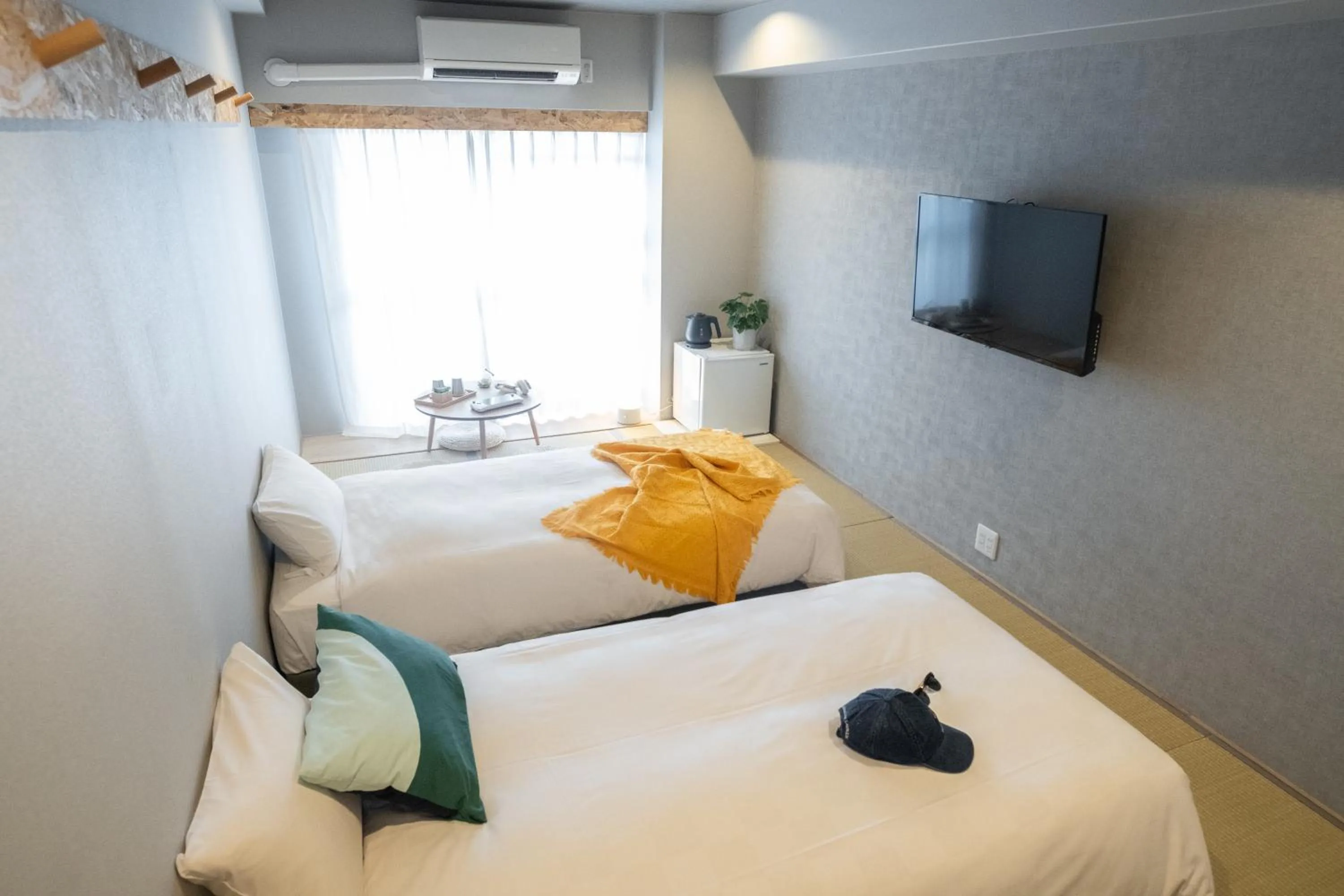 Bed in WAYFARER Kyoto Shijo