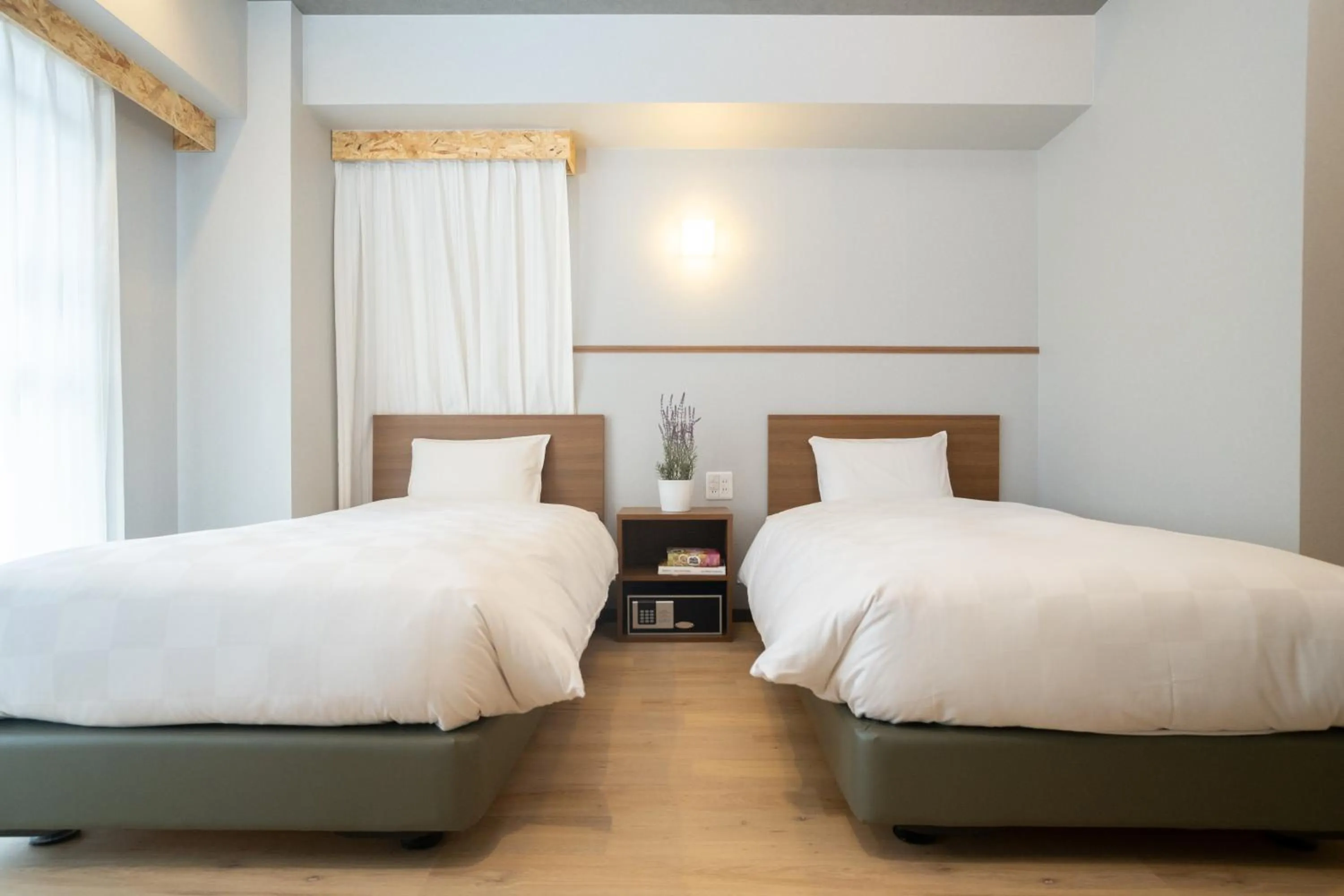Bed in WAYFARER Kyoto Shijo