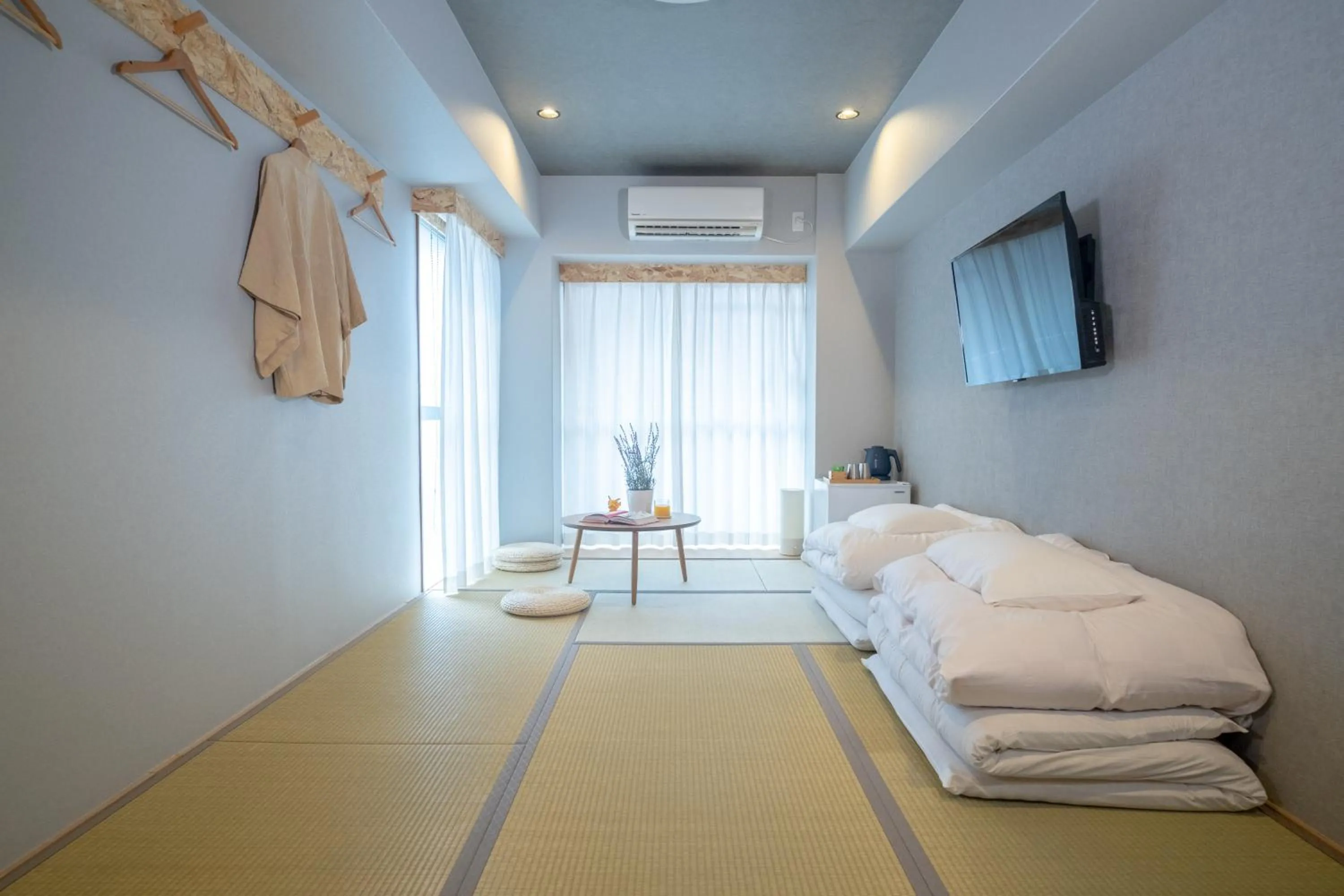 Bed in WAYFARER Kyoto Shijo