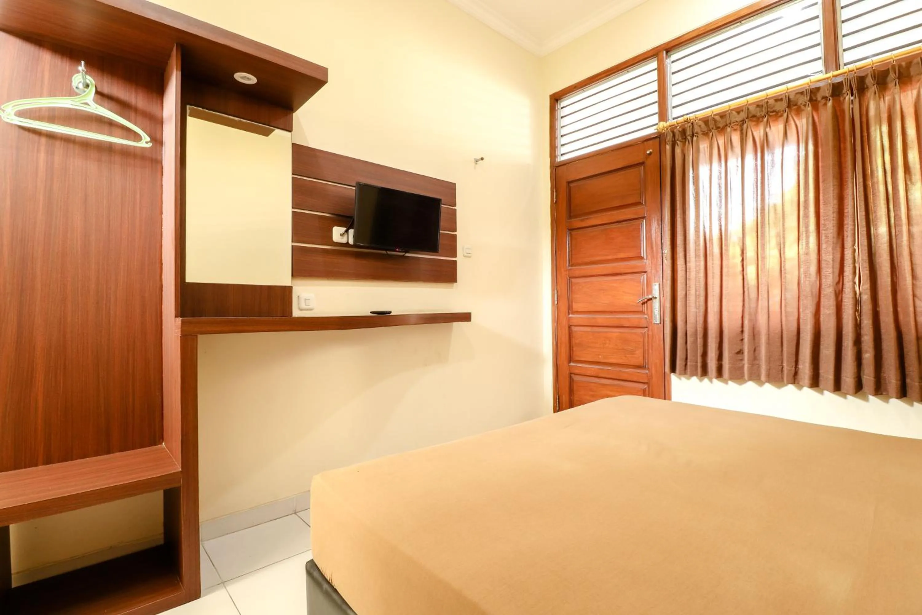 Bed in Hotel Bungurasih Syariah