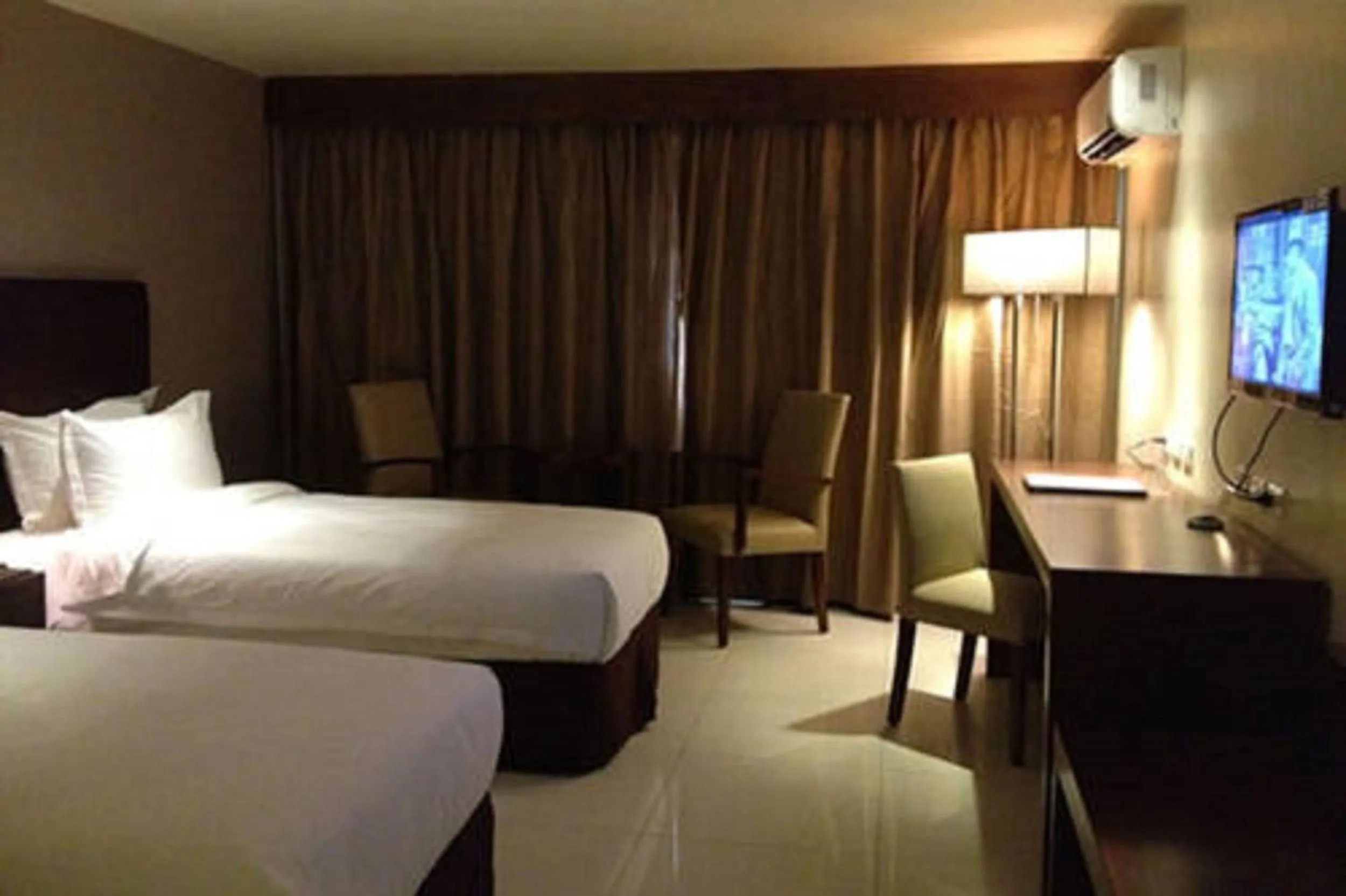 Bed in Mandarin Plaza Hotel