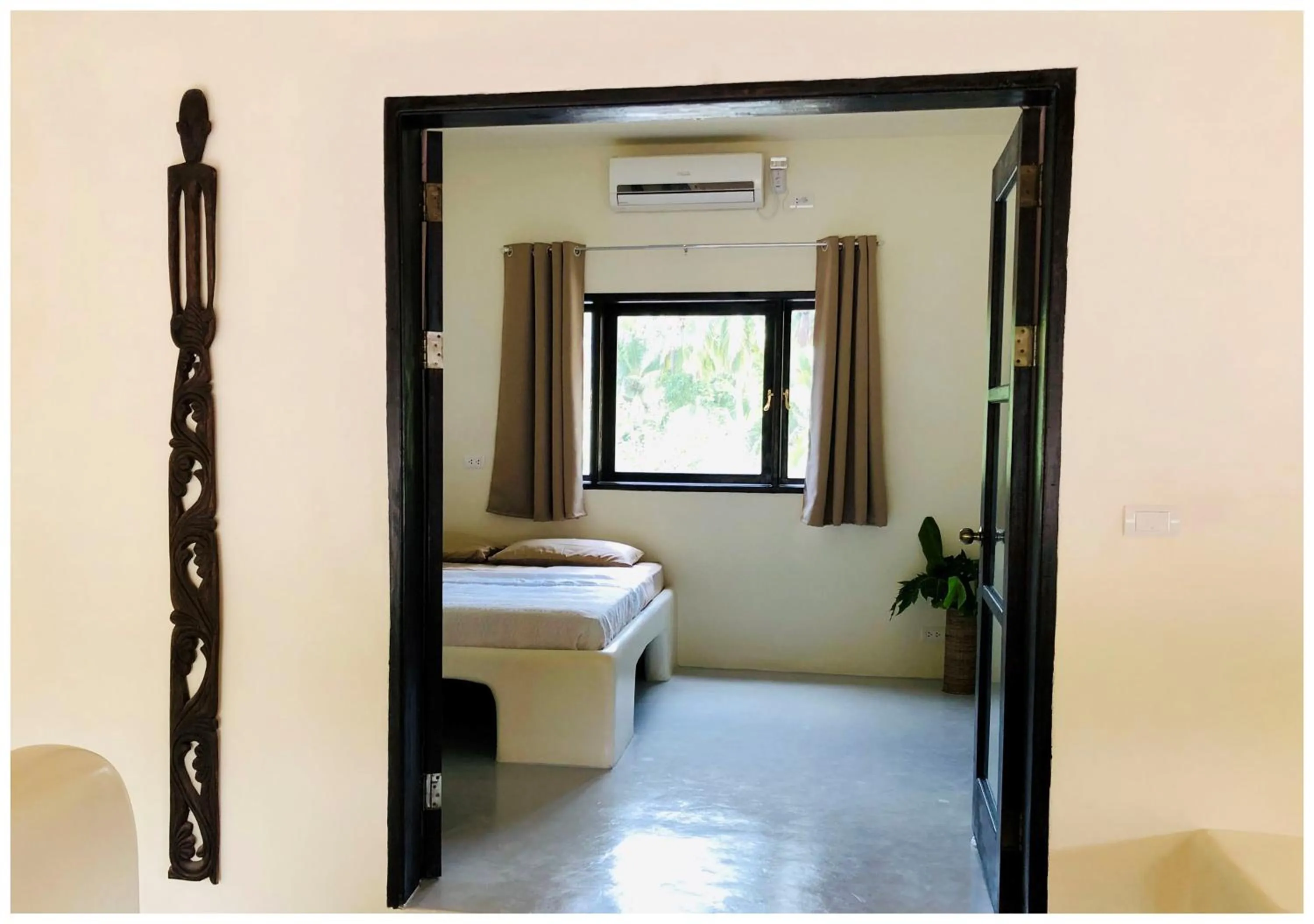 Bed in Parrots Boutique Resort