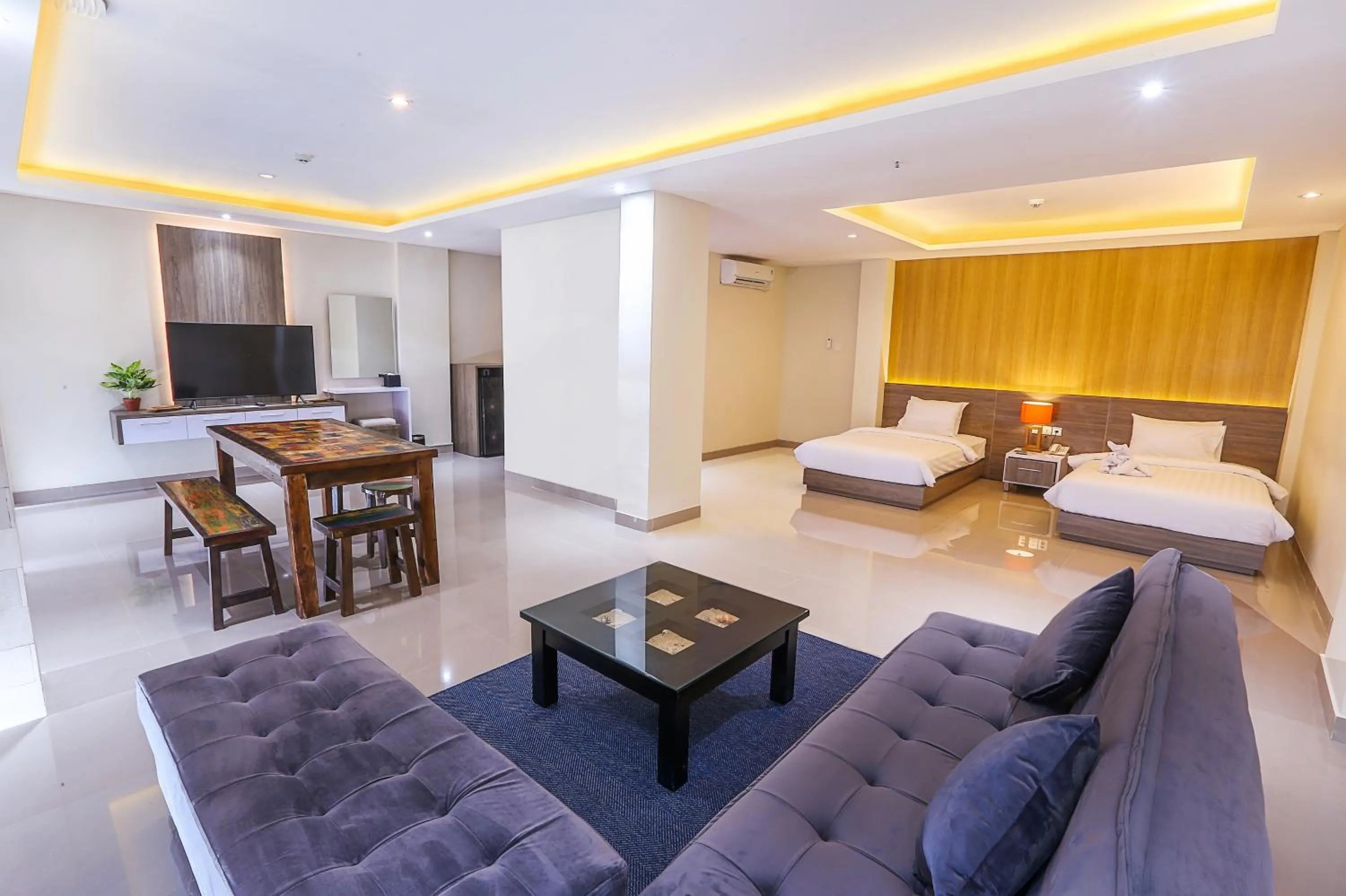 Seating area, Bed in Canggu Dream Village Hotel and Suites