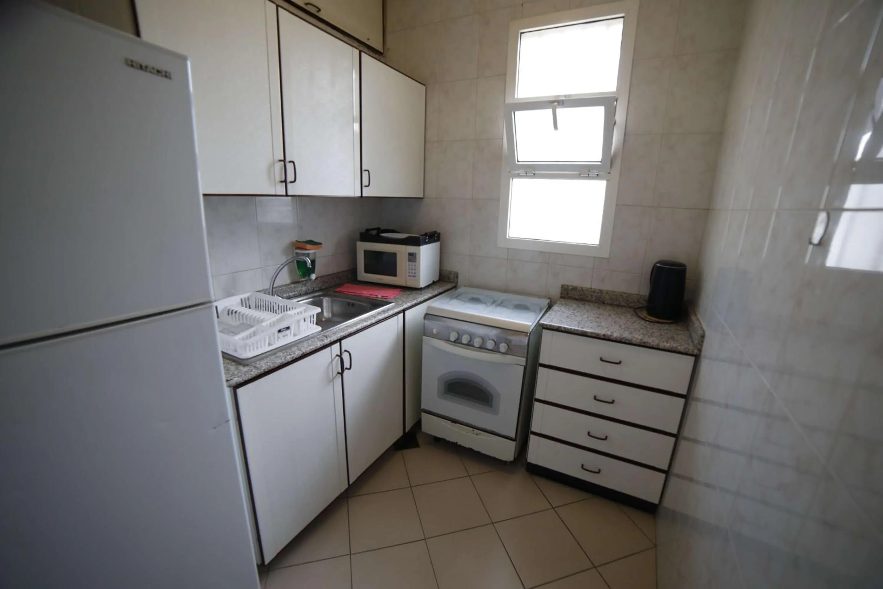 Kitchen or kitchenette in Holiday Home Suites