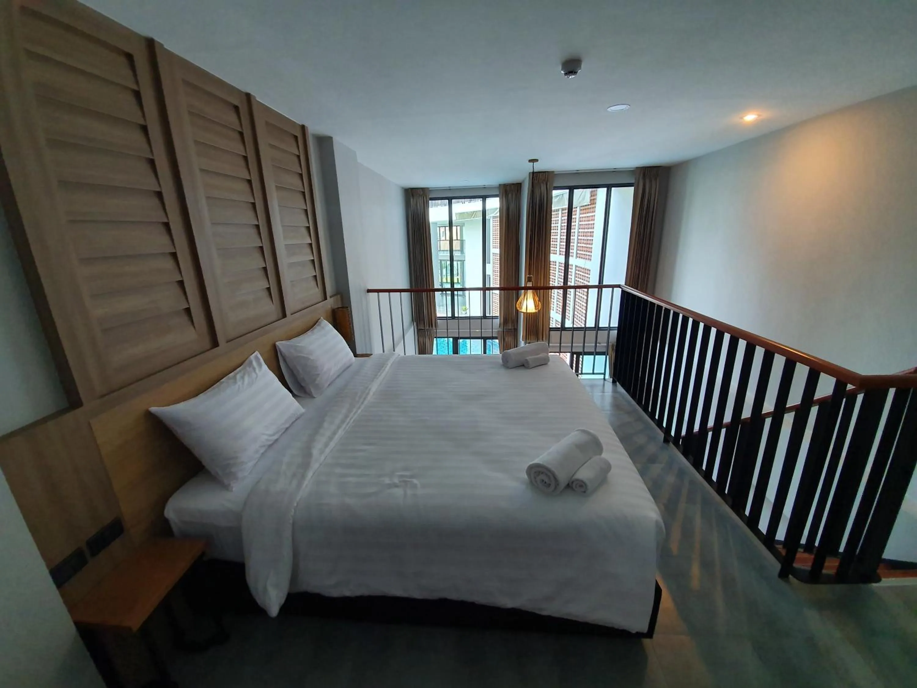 Bed in Atom Phuket Hotel