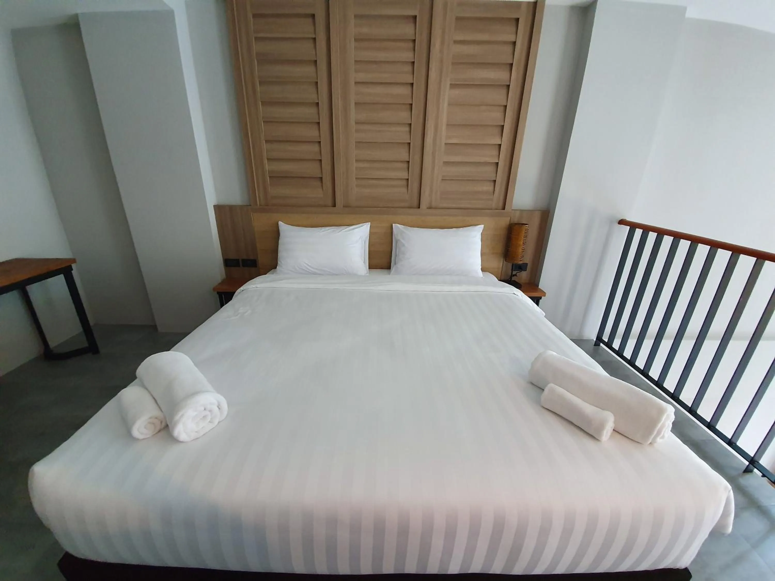Bed in Atom Phuket Hotel