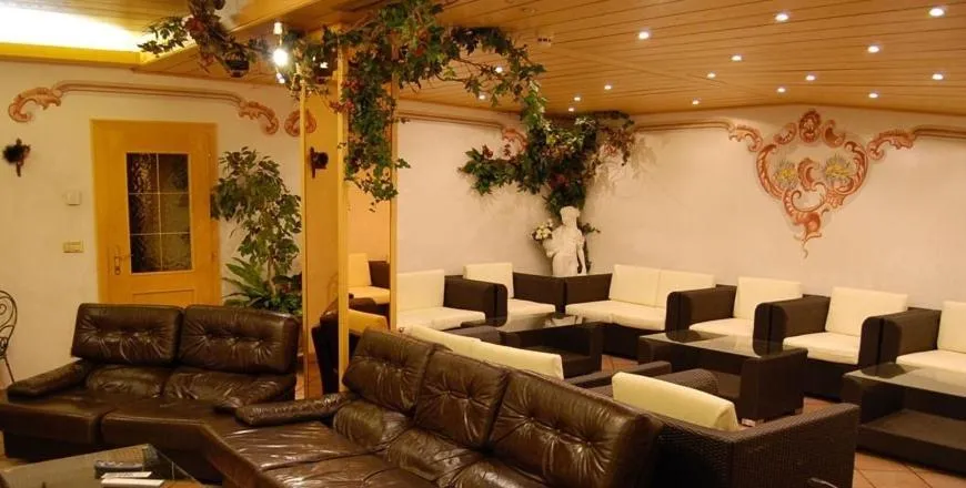 Communal lounge/ TV room in Albergo Genziana