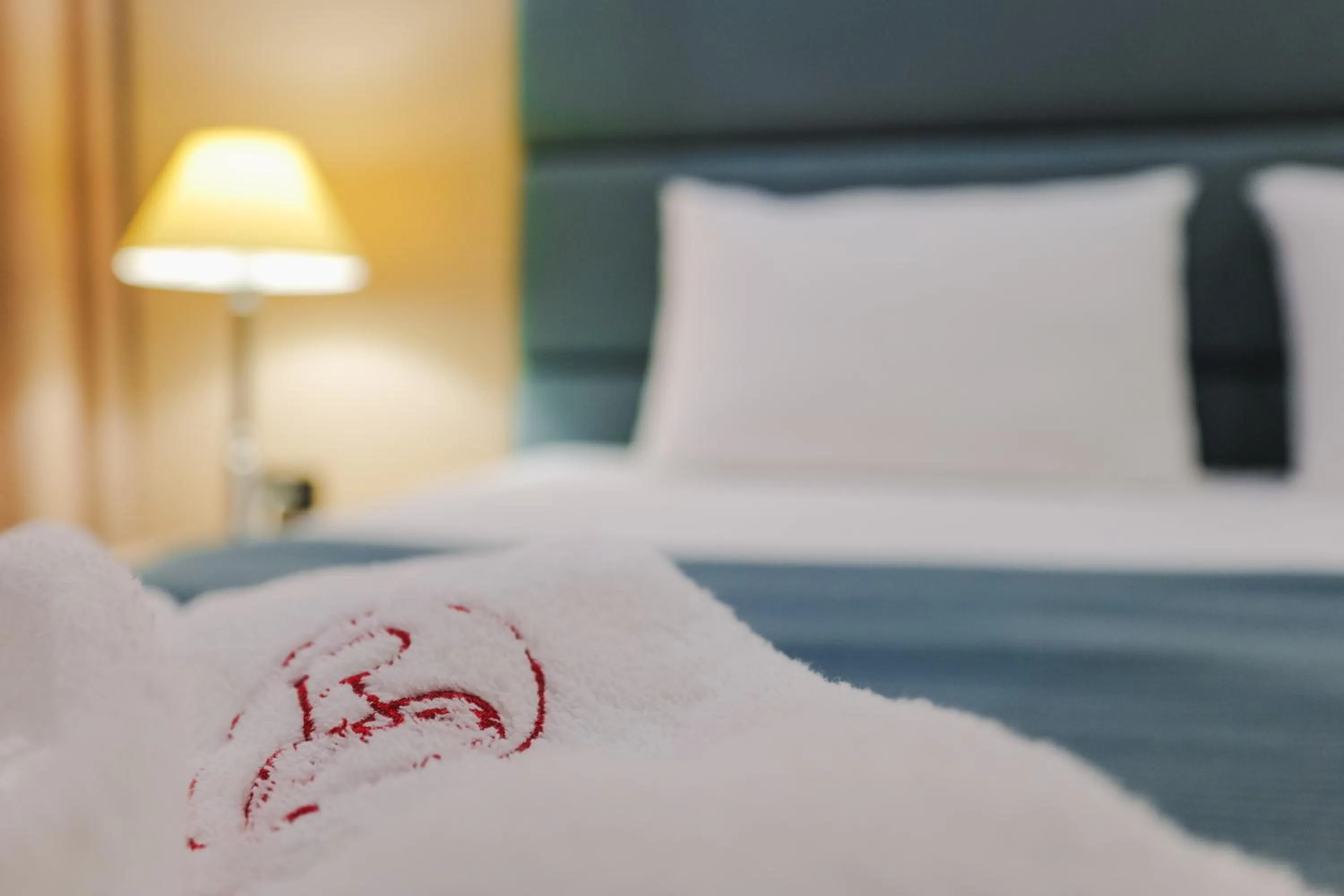 towels, Bed in Rapo's Resort Hotel