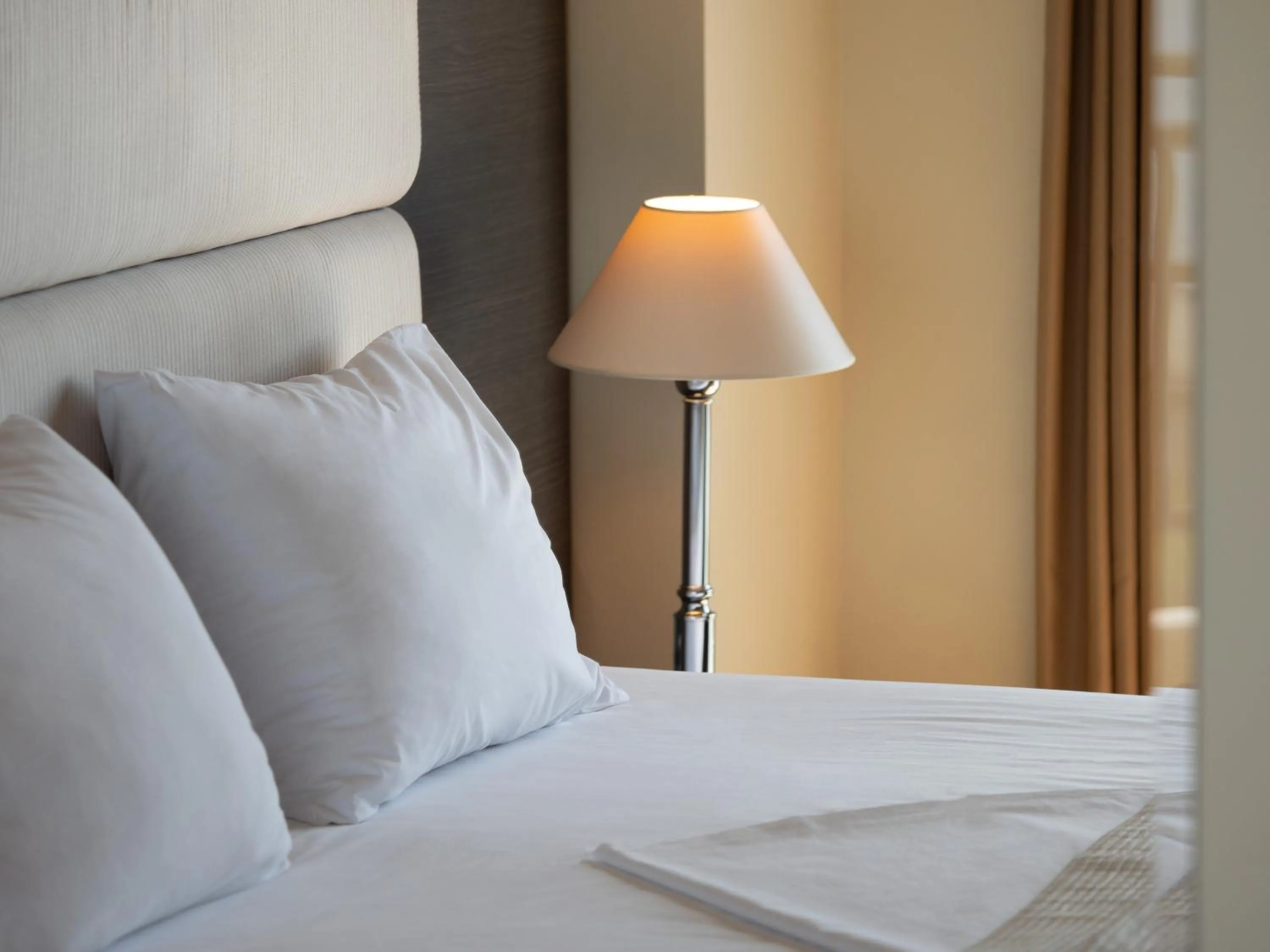 Bed in Rapo's Resort Hotel