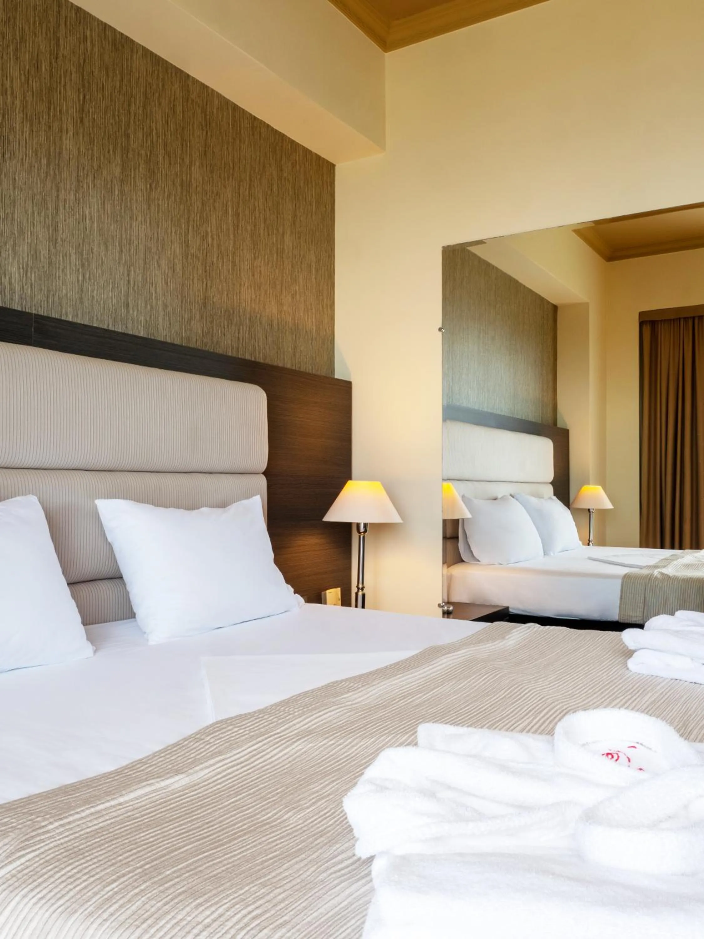 Bed in Rapo's Resort Hotel