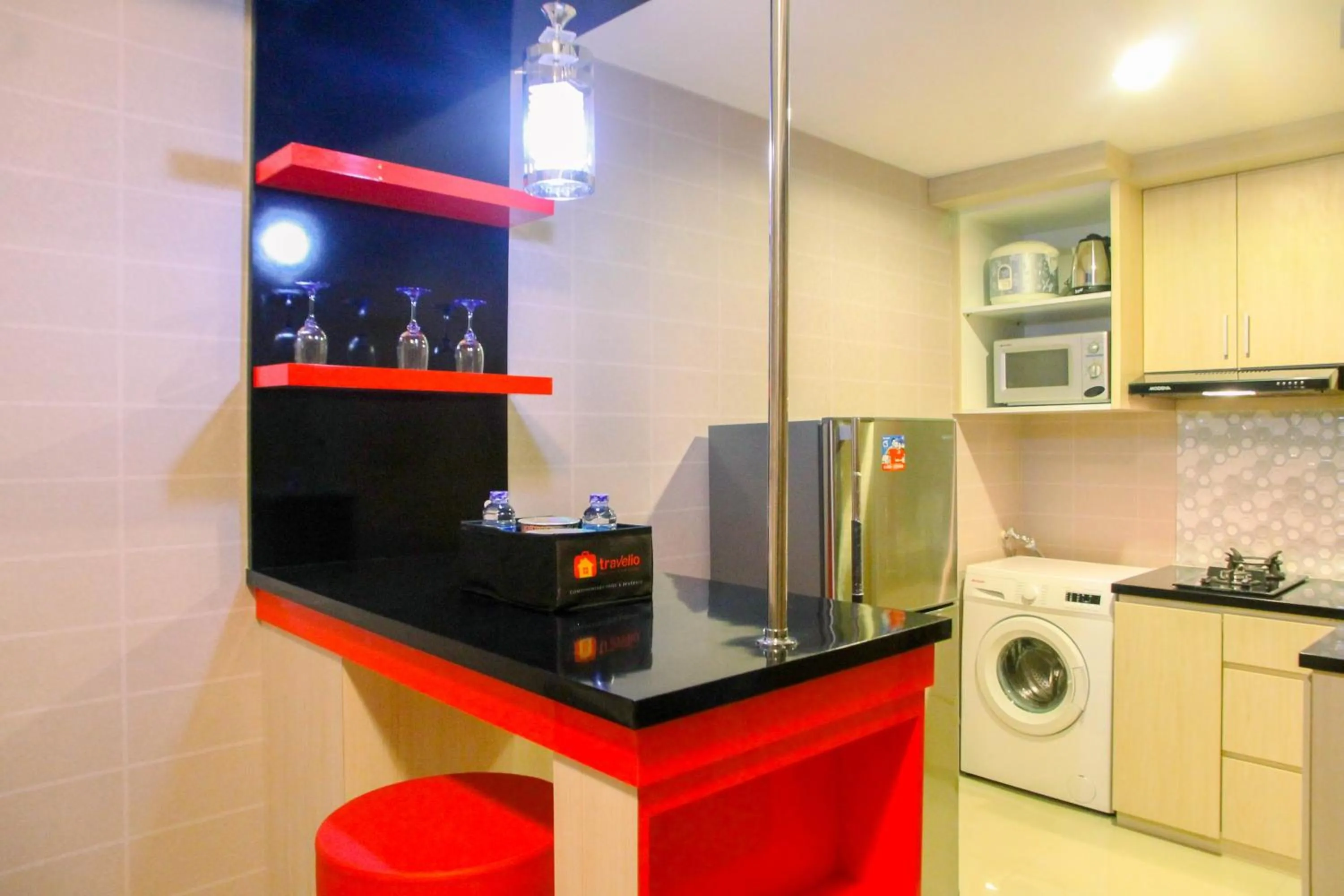 Kitchen or kitchenette in Best Price 1BR Apartment at The Oasis Cikarang By Travelio