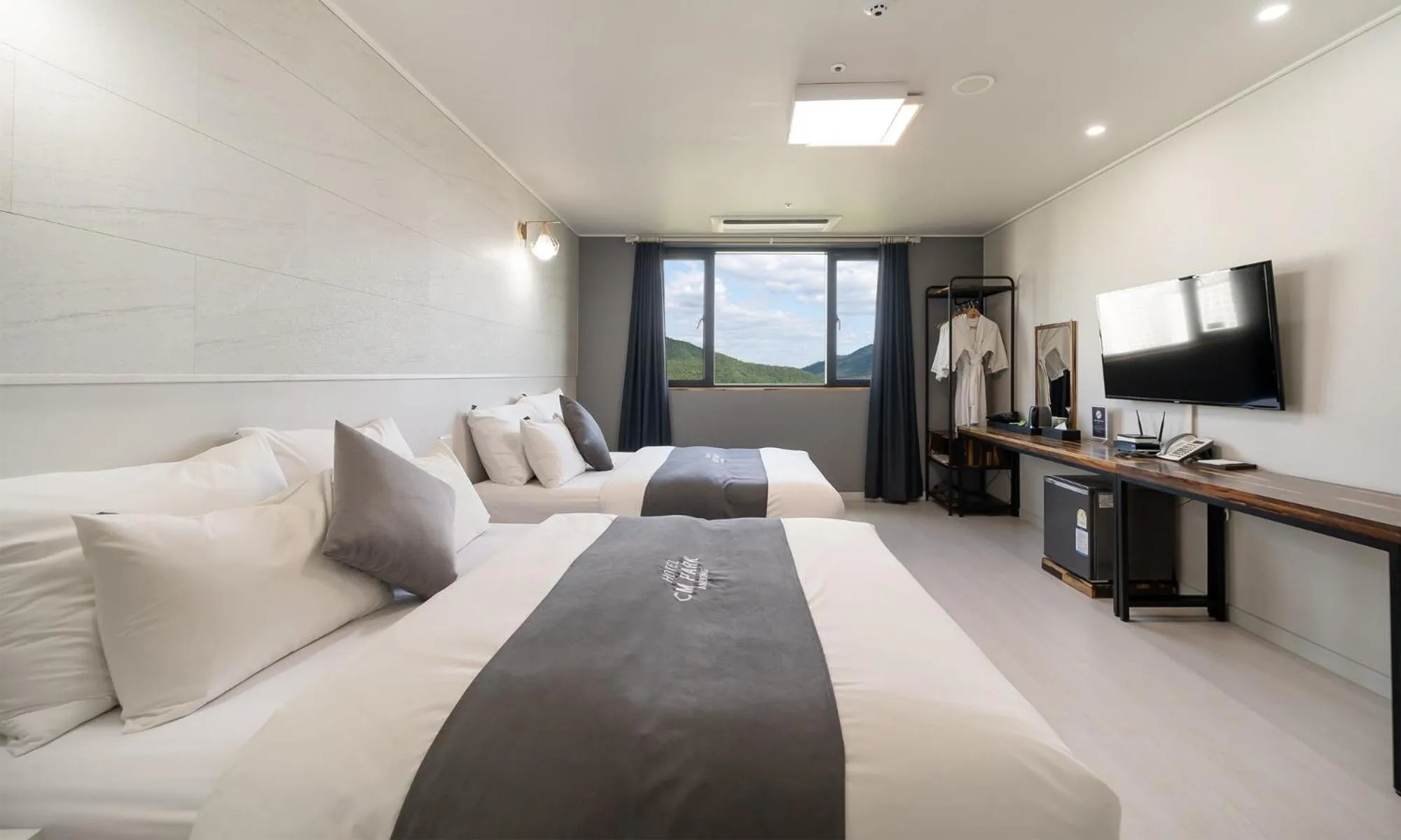 Bed in CM Park Hotel