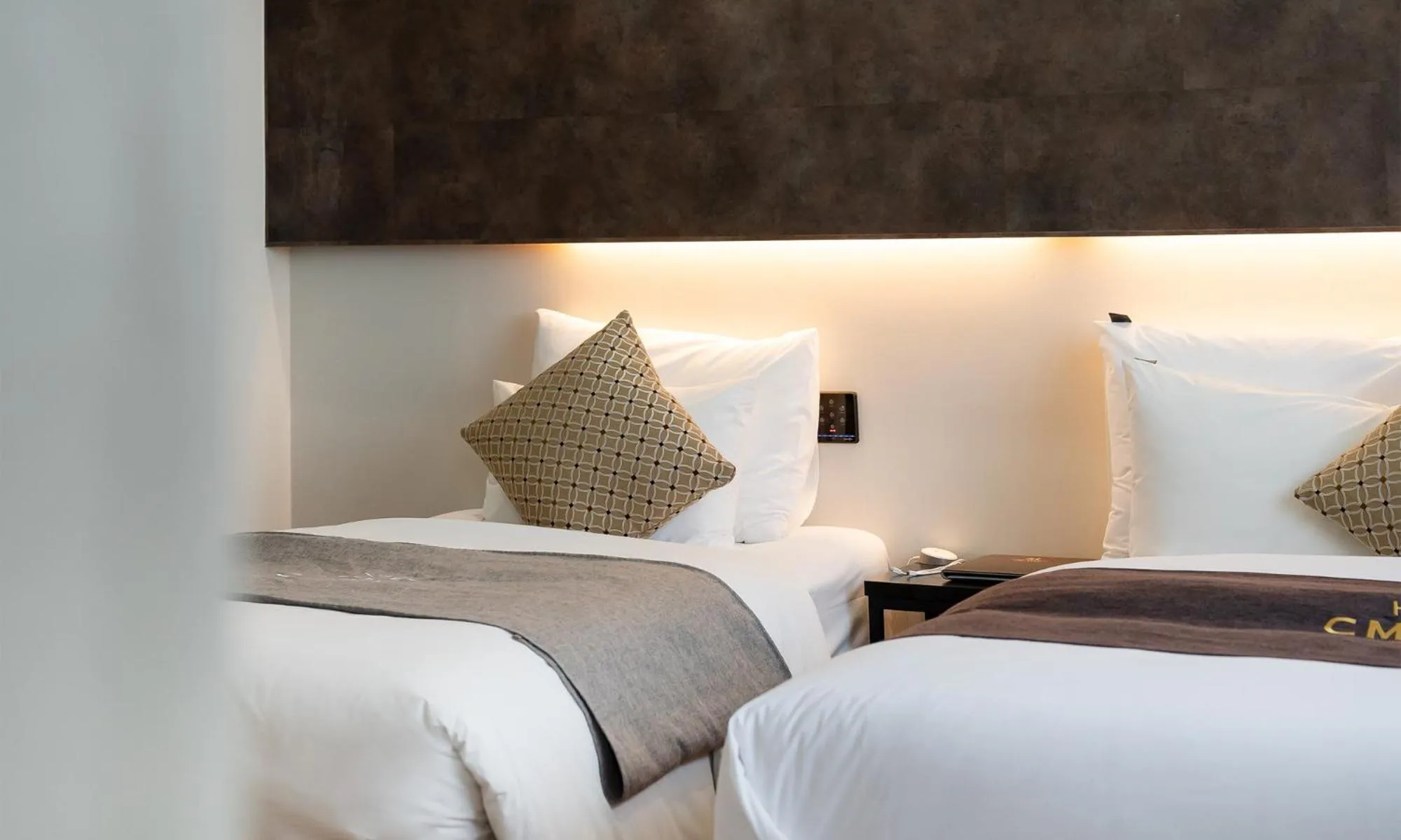 Bed in CM Park Hotel