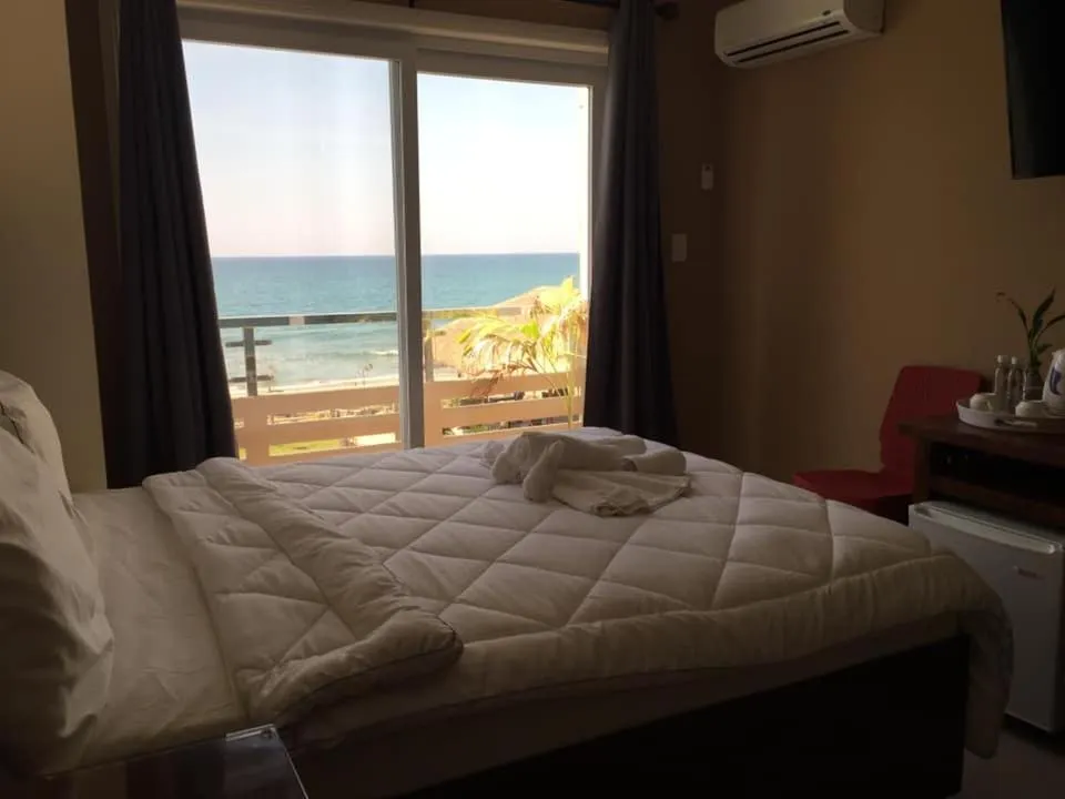 Balcony/Terrace, Bed in EM Royalle Hotel & Beach Resort