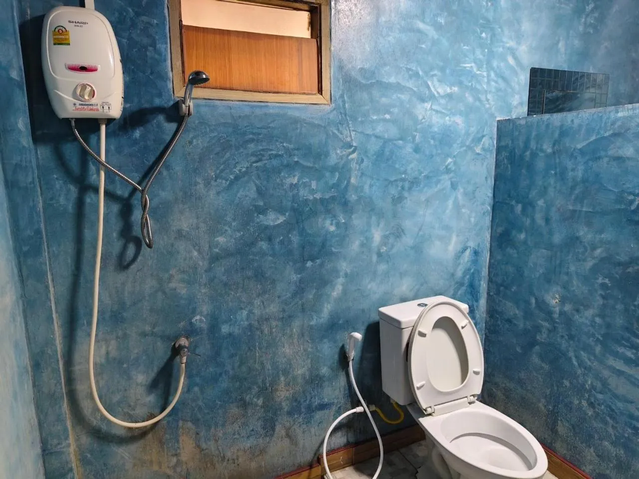 Toilet in Pooma Resort