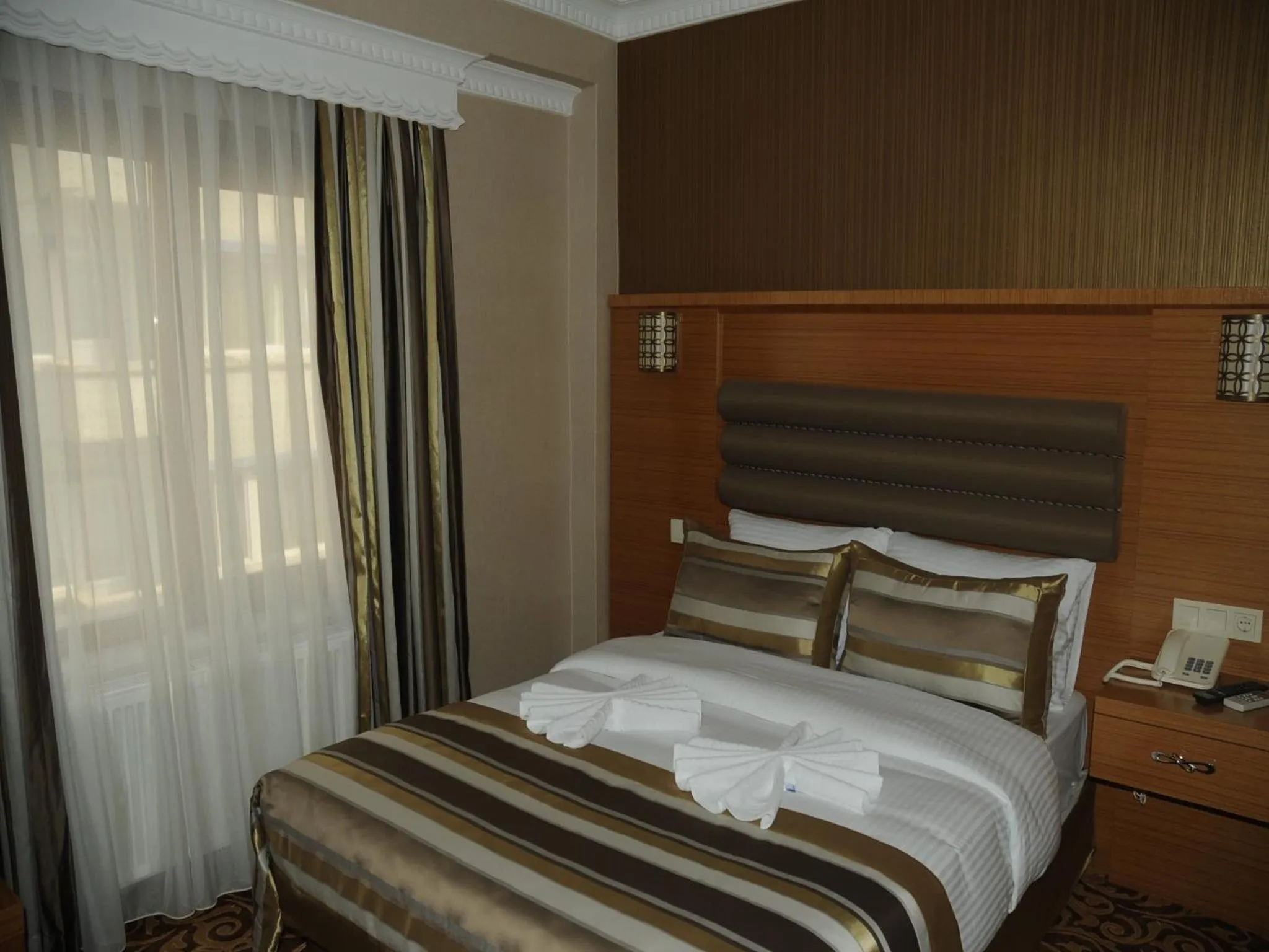 Bedroom in Alfa Hotel