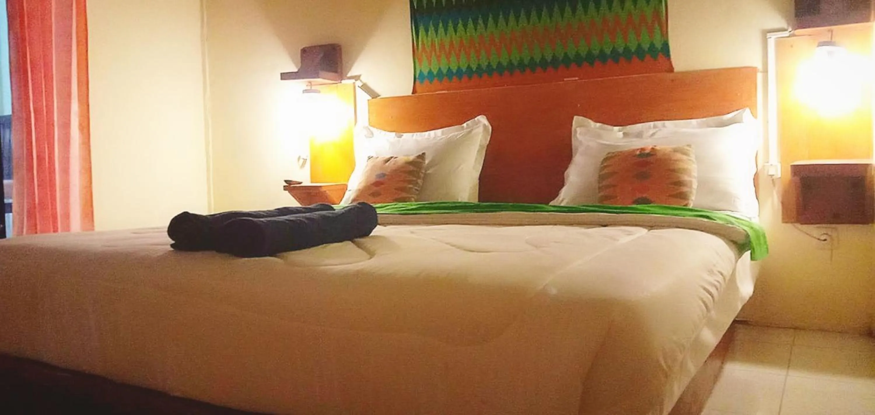 Bed in Angin Mamiri Rinjani Cottages And Restaurant