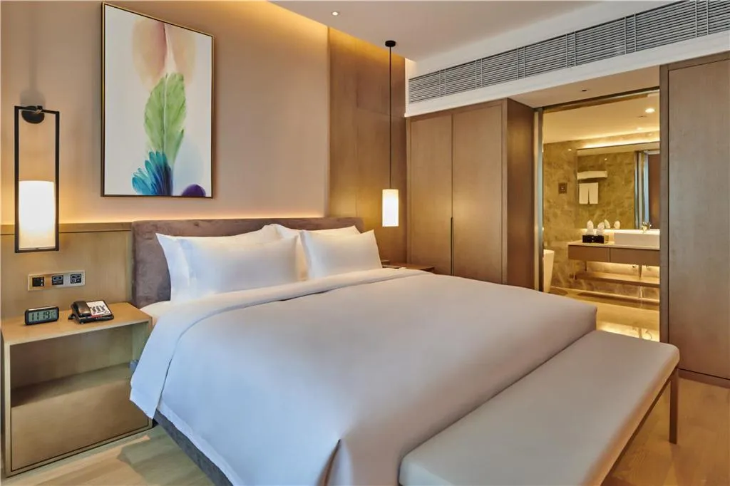 Bed in LIUZHOU PENGYI Hotel