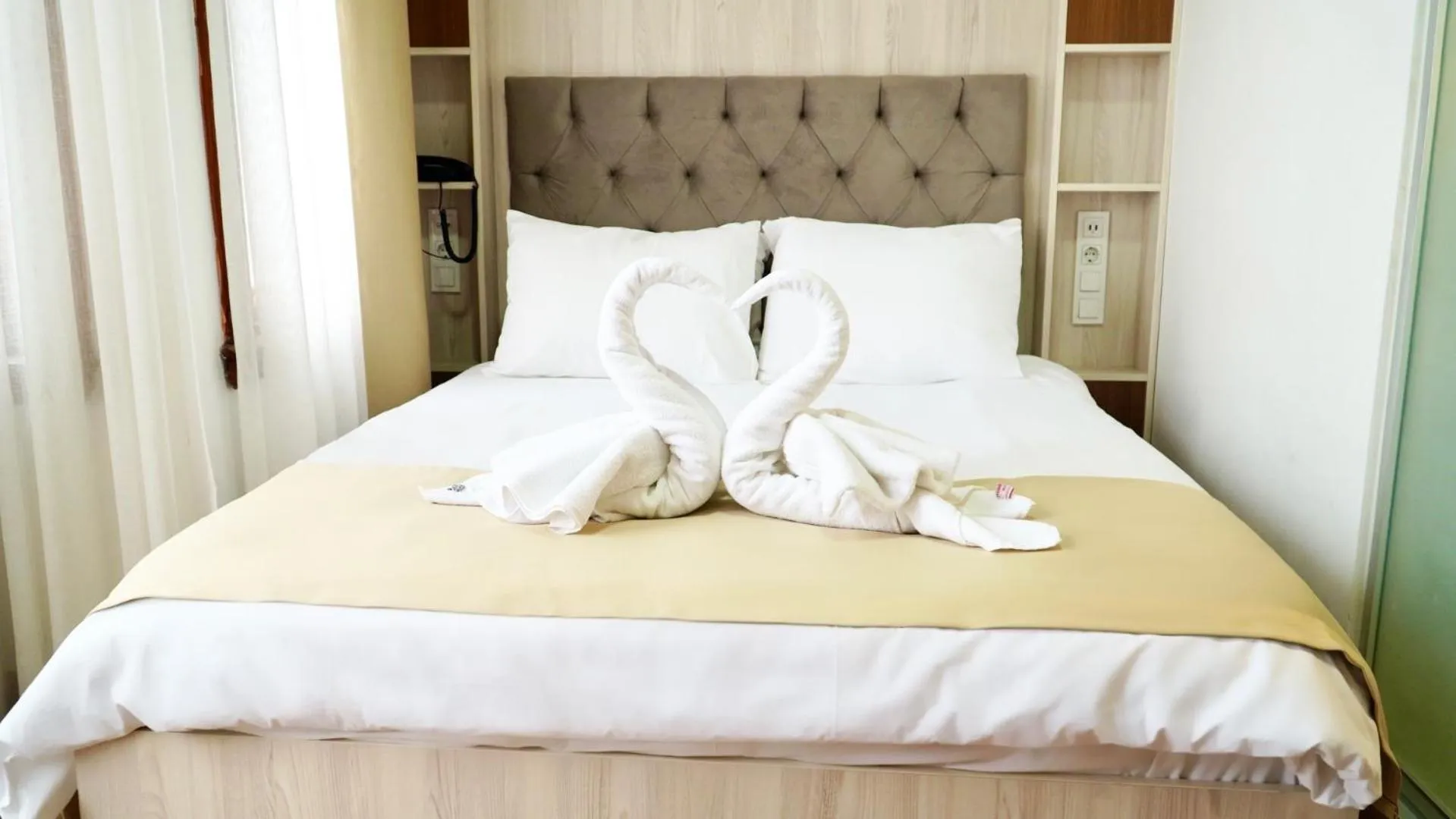 Bedroom in QONAQ HOTEL & SUITES