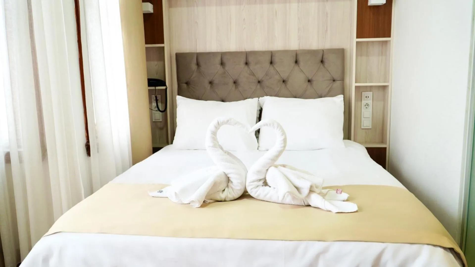 Bedroom in QONAQ HOTEL & SUITES