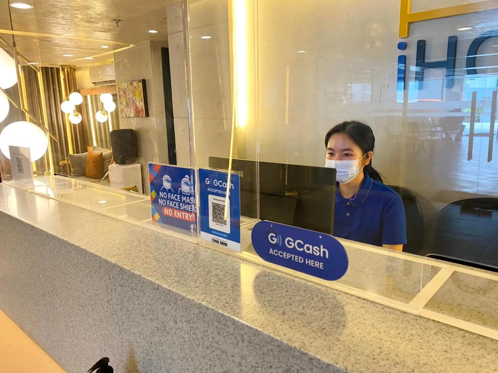 Property logo or sign in iHotel Uptown BGC