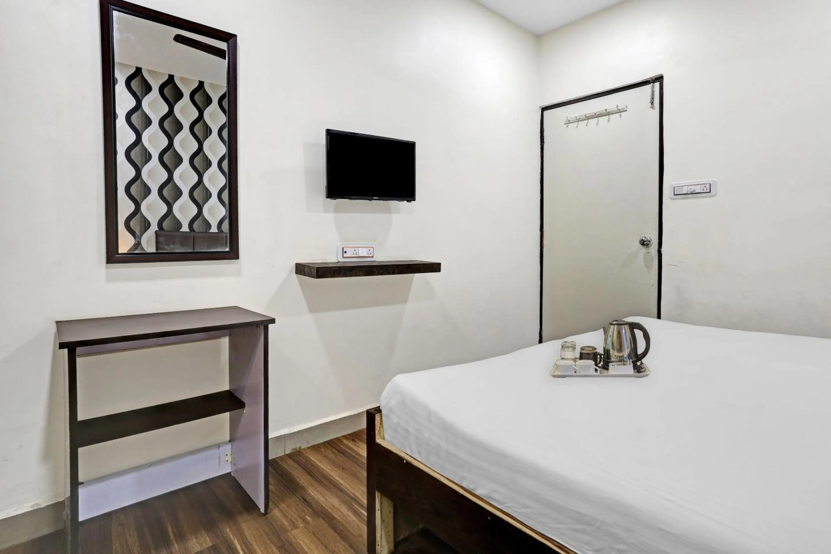 Bedroom in Hotel O Happy Stay