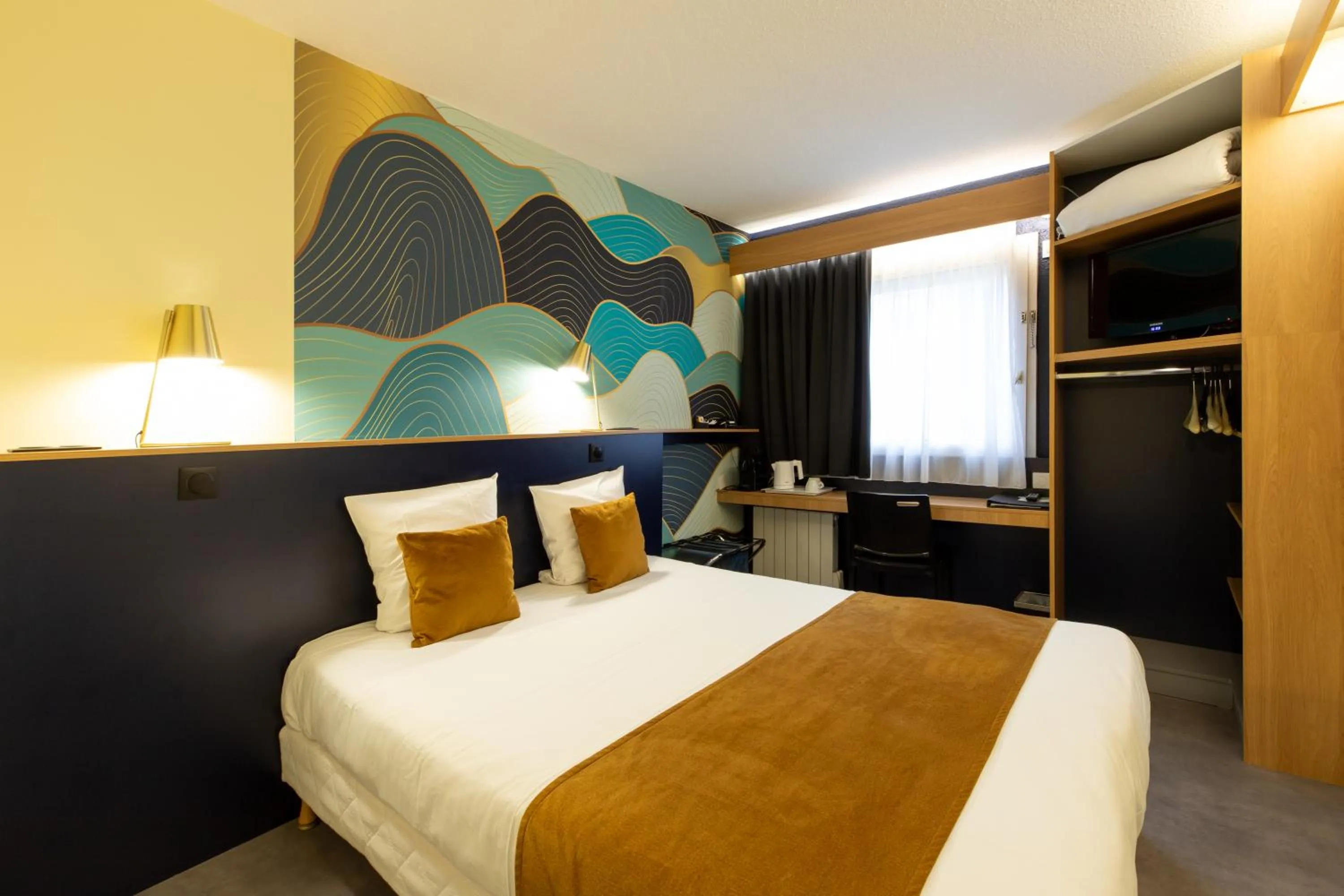 Bed in Logis Hôtel du Haut-Bugey