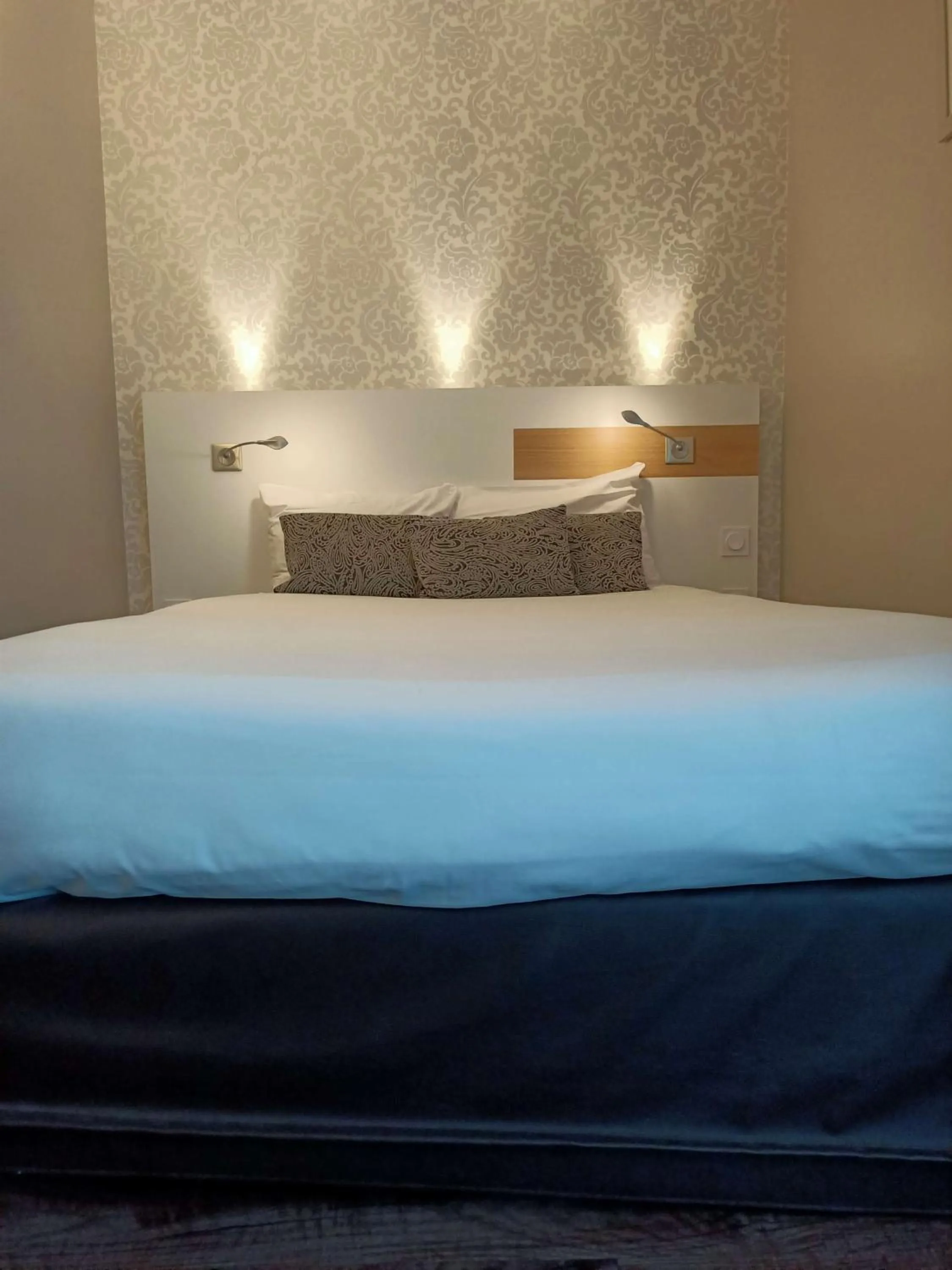 Bedroom in Brit Hotel Les Alizes